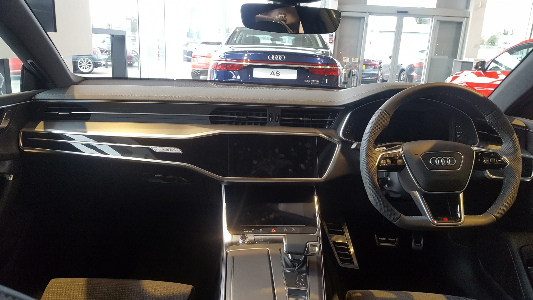 Modern dashboard and multifunctional steering wheel interior design.