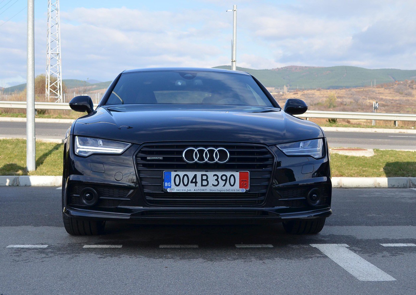 Front view with LED headlights and distinctive grille