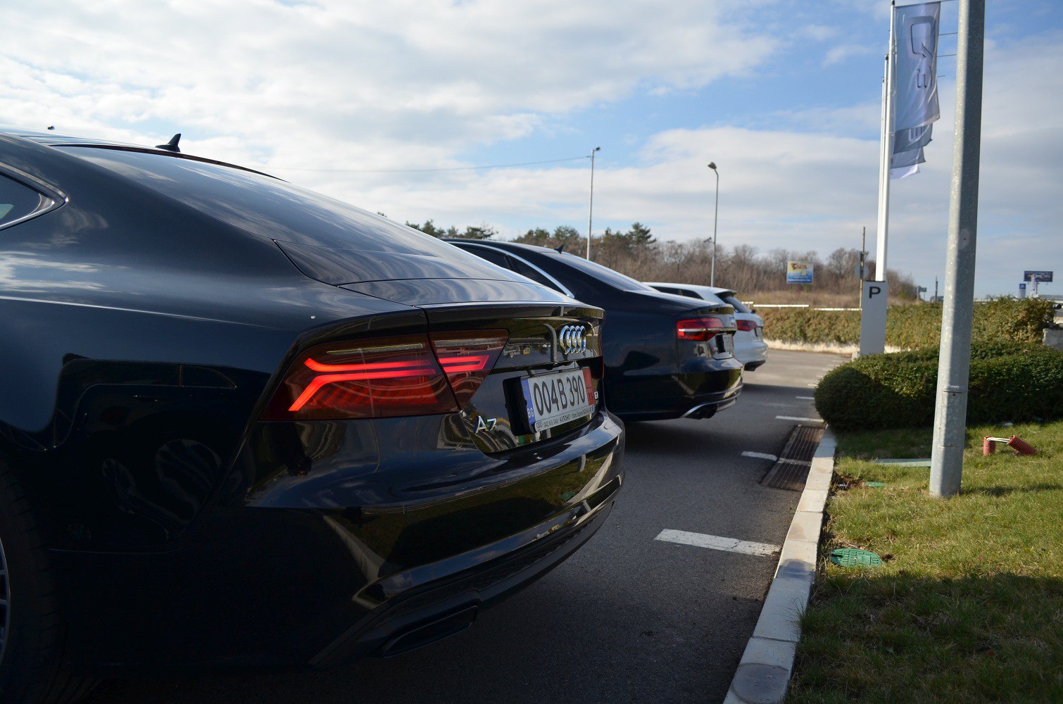 Rear LED tail lights and sporty rear styling of a luxury sedan