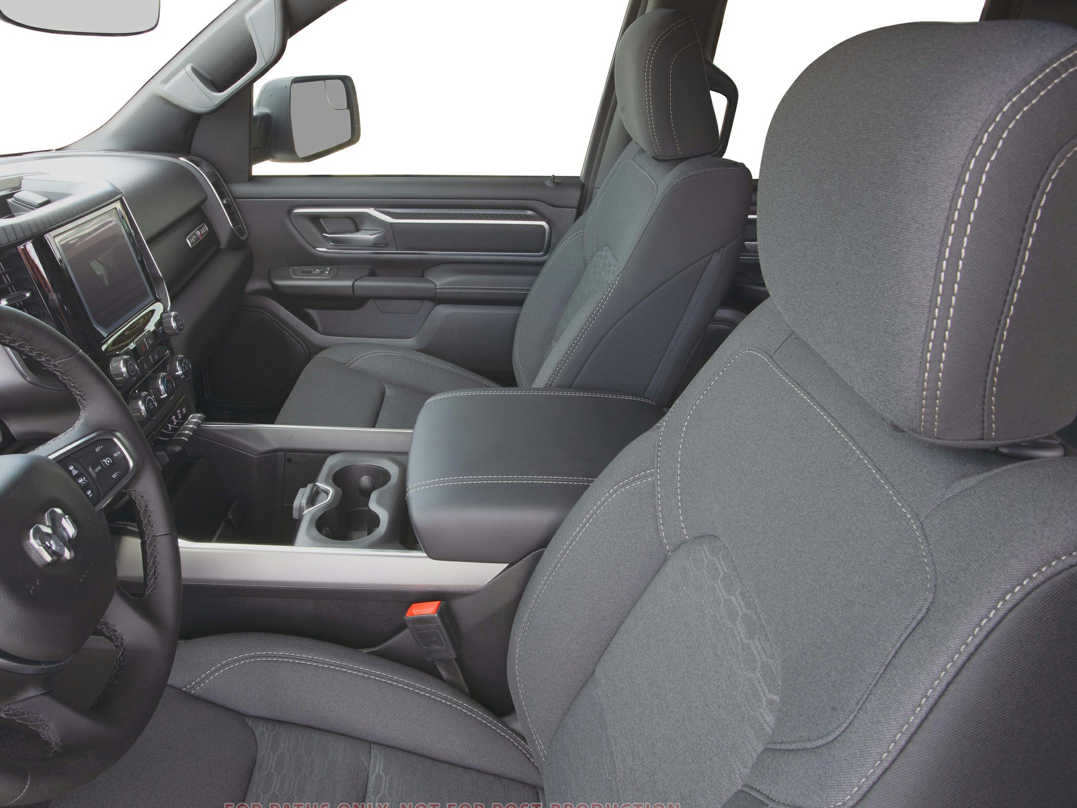 Spacious front seats with detailed upholstery and modern dashboard controls