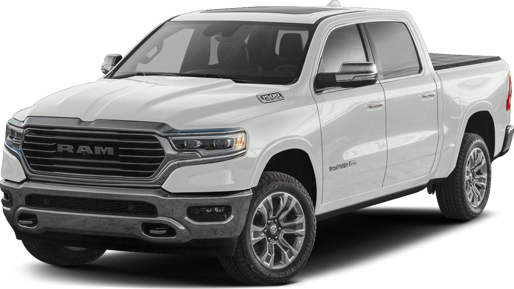 White pickup front-side view with grille, headlights, and alloy wheels