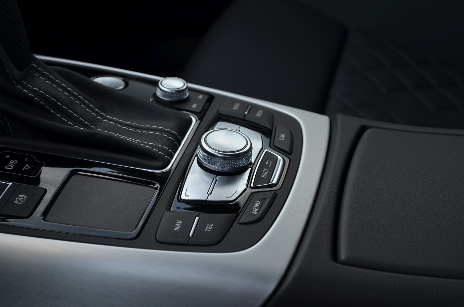 Center console control knob and leather gear shift area