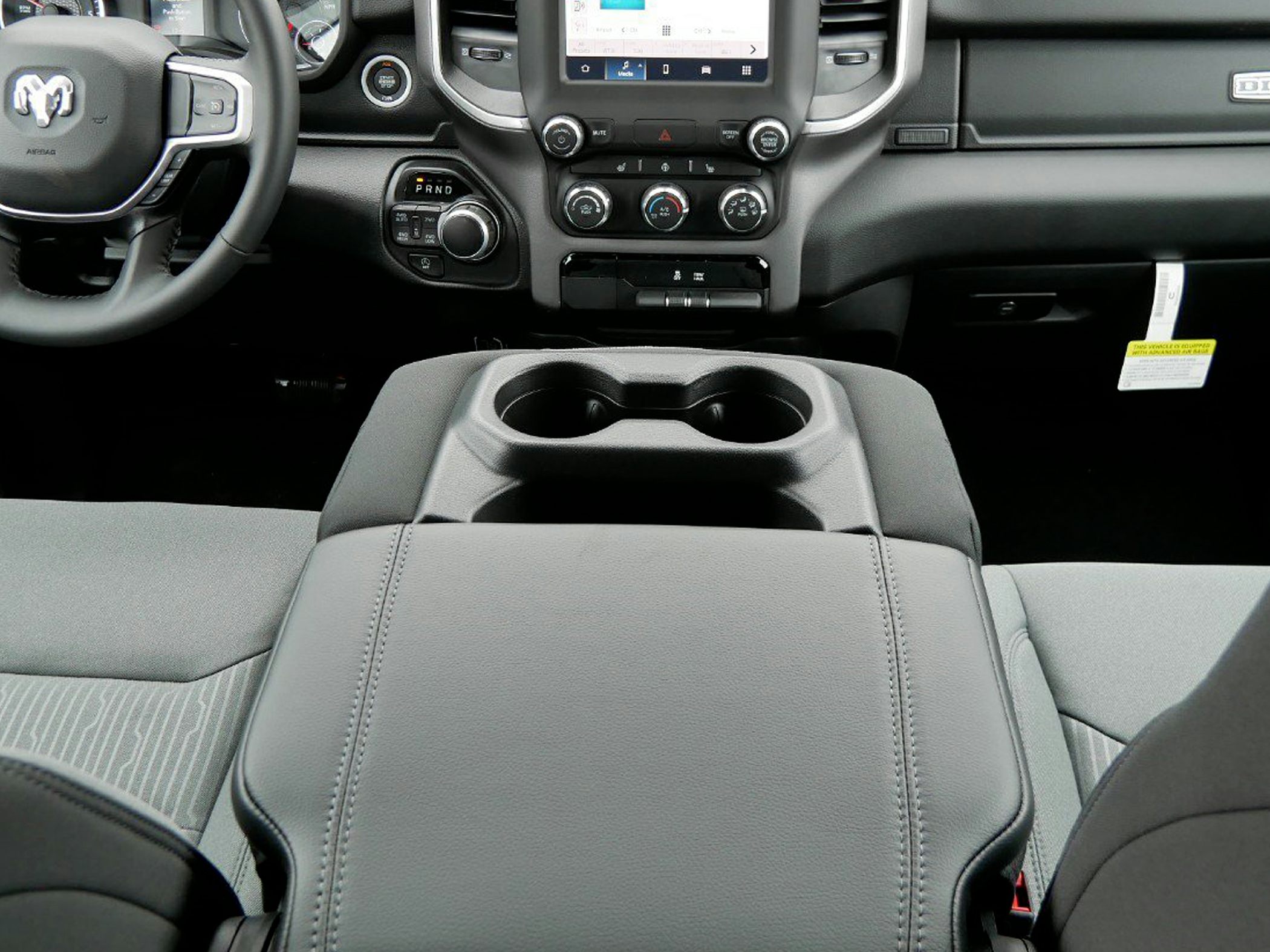 Front center console with cup holders and dashboard controls