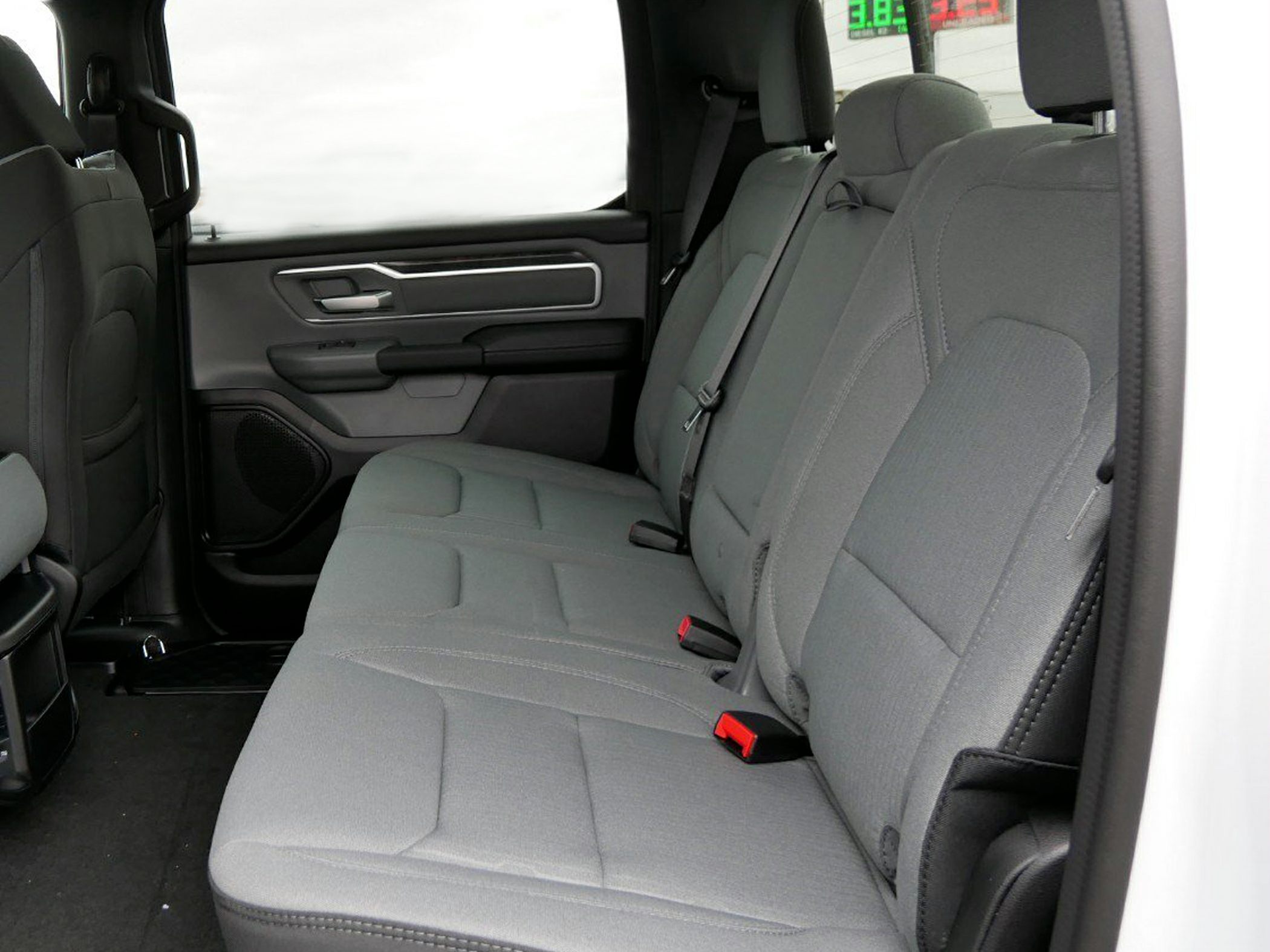 Fabric rear seats and door panel with modern design in a spacious crew cab interior.