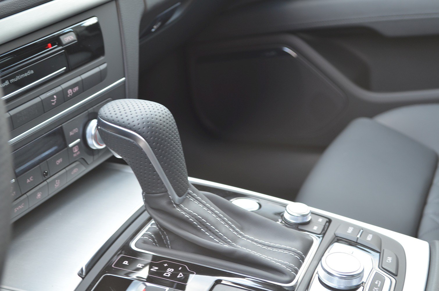 Leather gear shift lever and center console controls with chrome accents