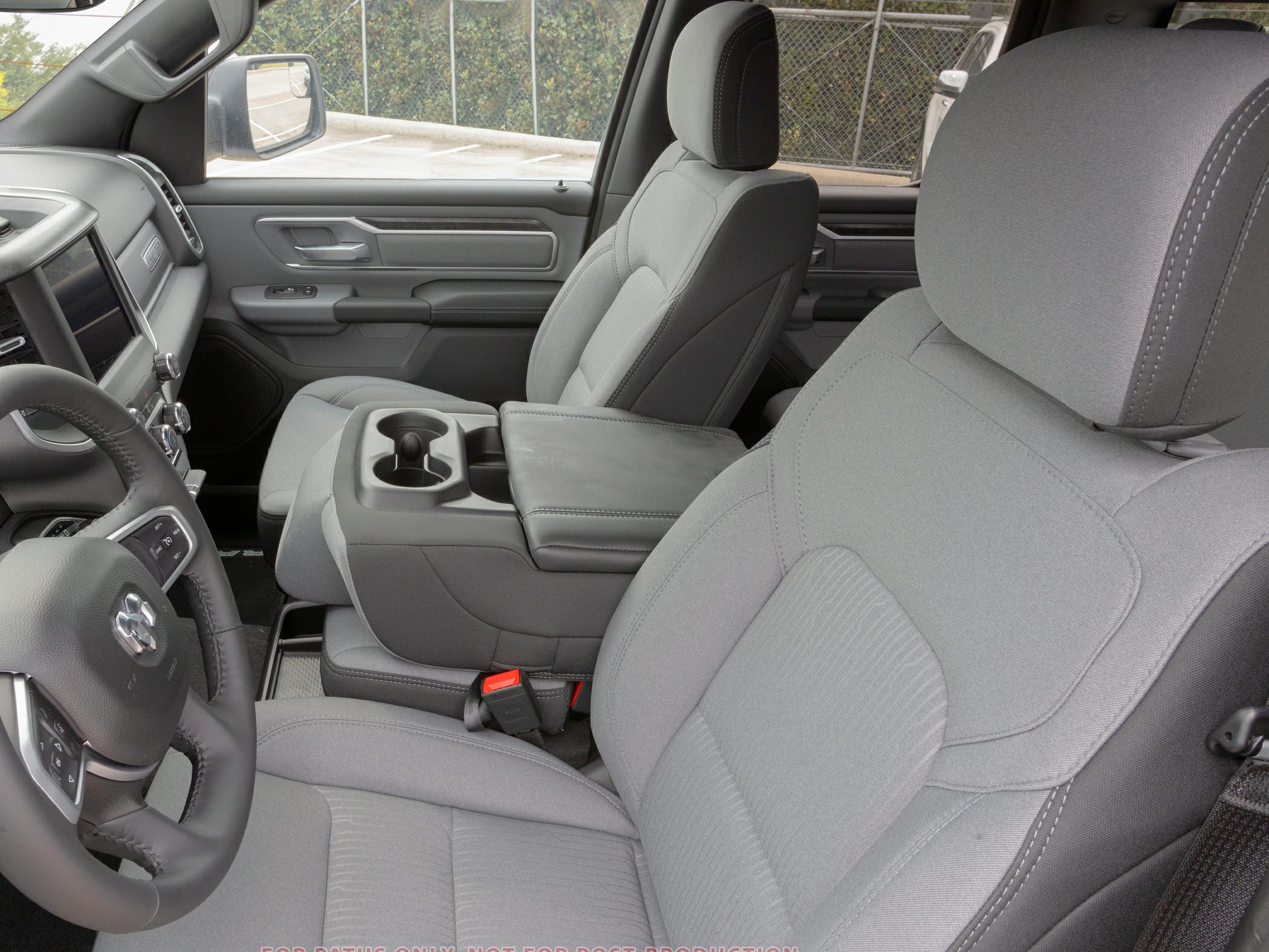 Front fabric seats and center console with cup holders