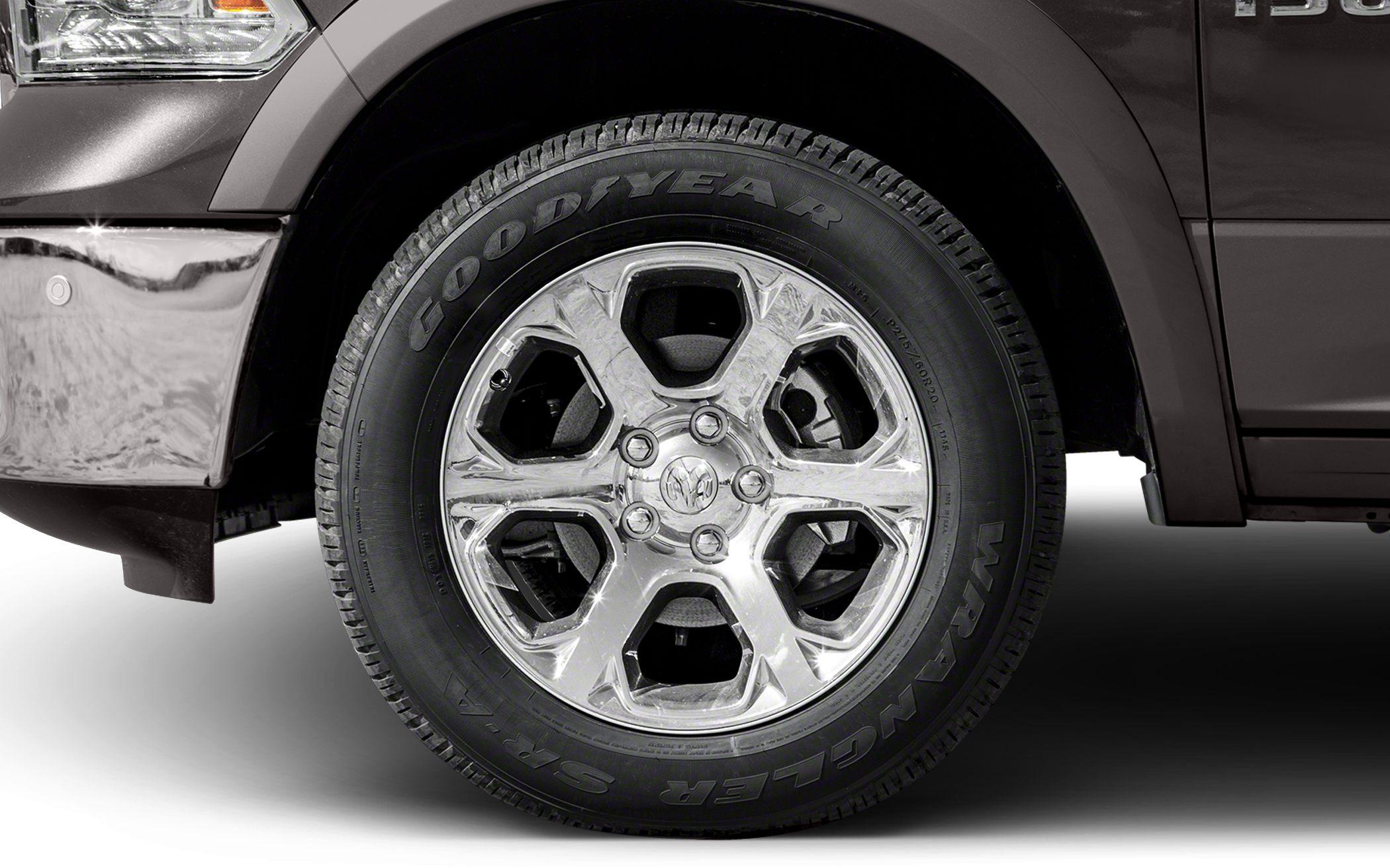 Chrome alloy rim and Goodyear Wrangler tire close-up