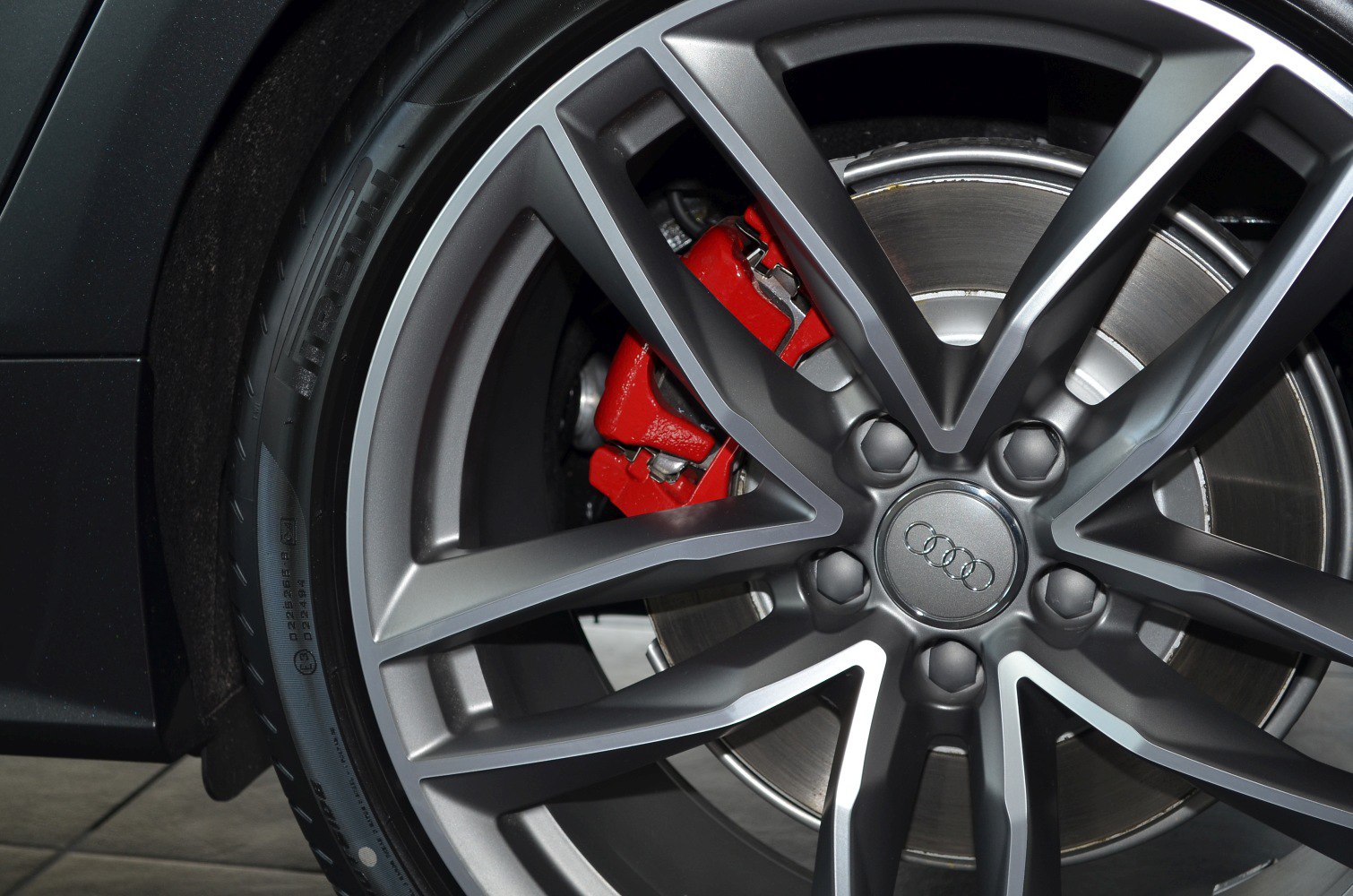 Alloy wheel with red brake caliper and brake disc