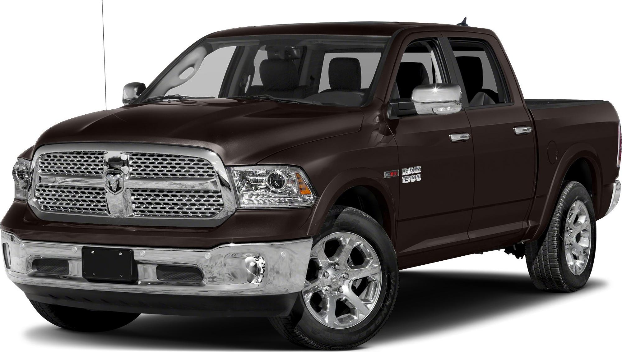Front grille and chrome alloy wheels of a crew cab short pickup.