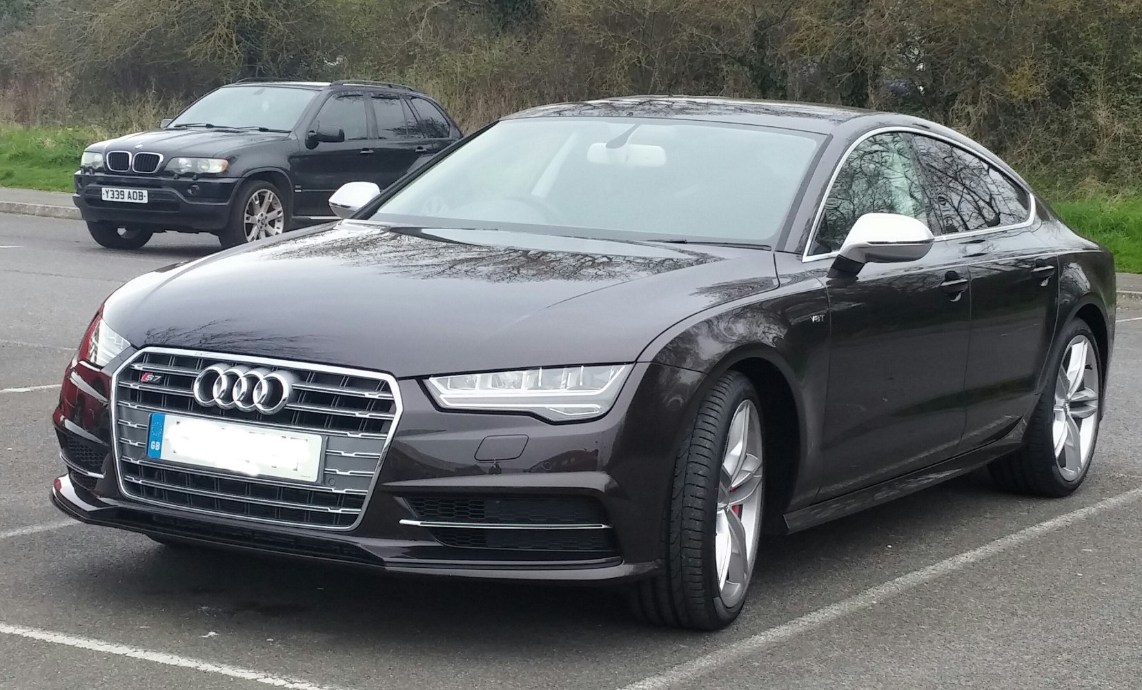 Front view showcases LED headlights and alloy wheels.