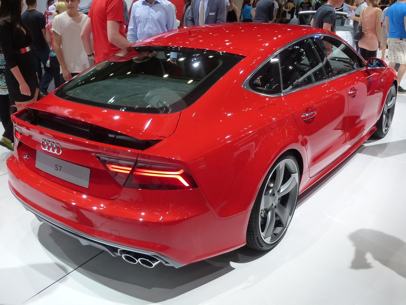 Rear view of red sportback with quad exhaust and LED taillights.