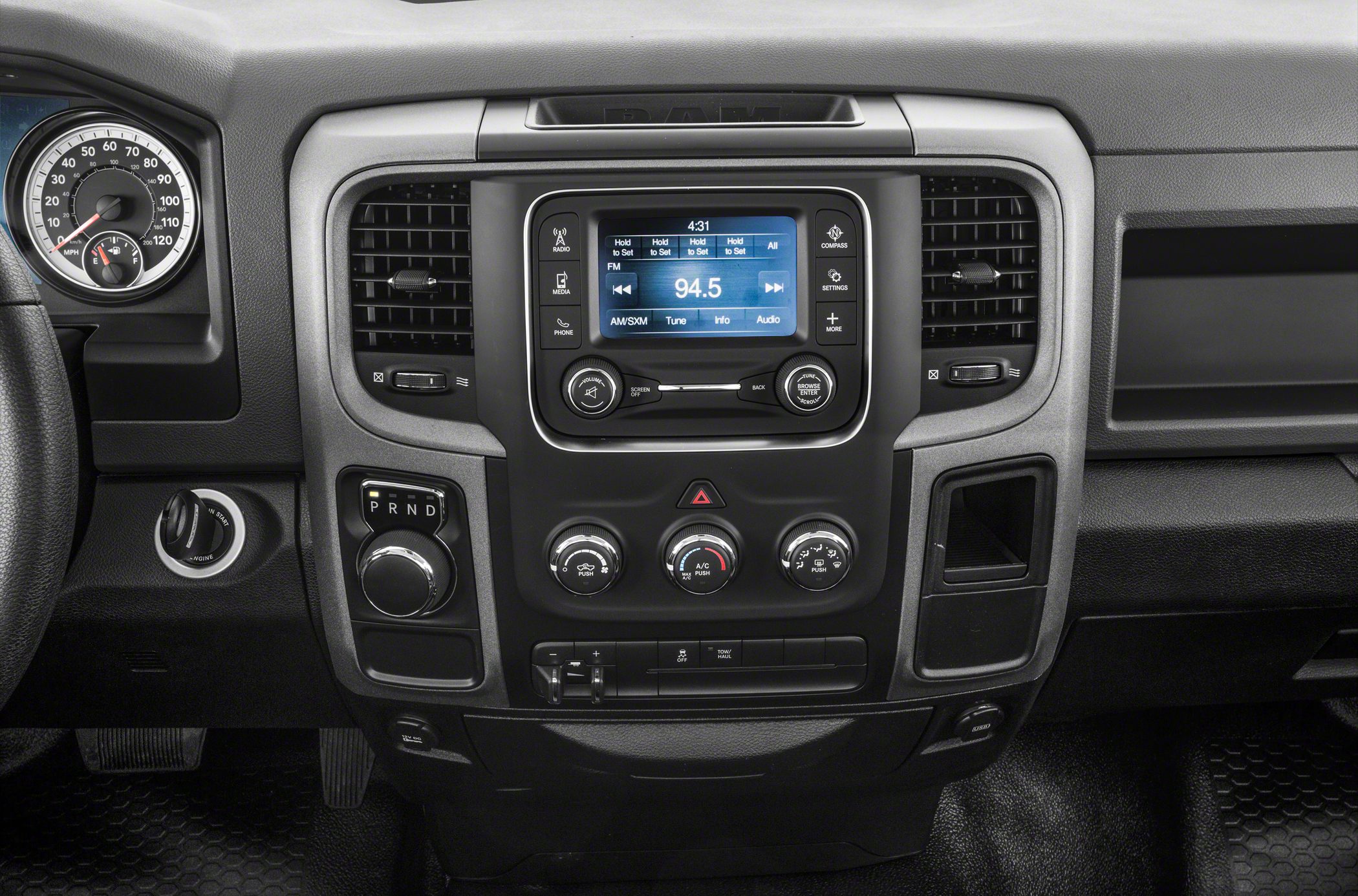 Dashboard with rotary gear shifter and center console with radio and climate controls