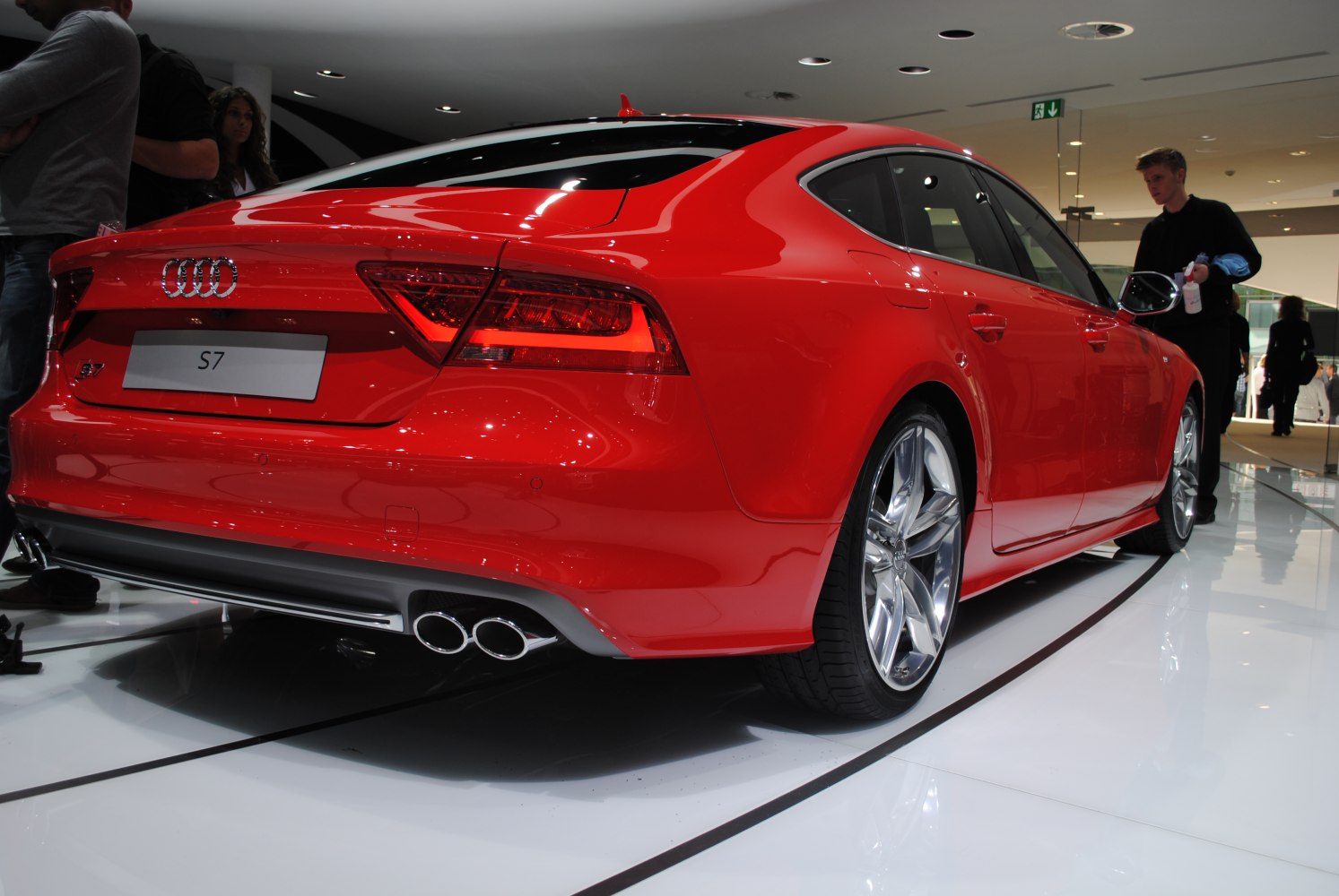 Rear side view of red Audi S7 with quad exhausts and alloy wheels