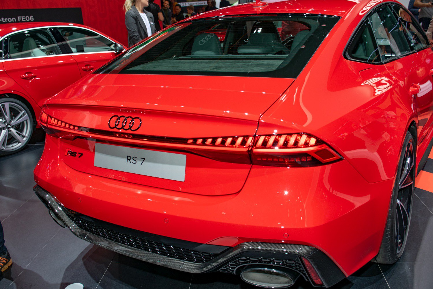 Stylish rear with LED taillights and dual exhaust of a red sportback