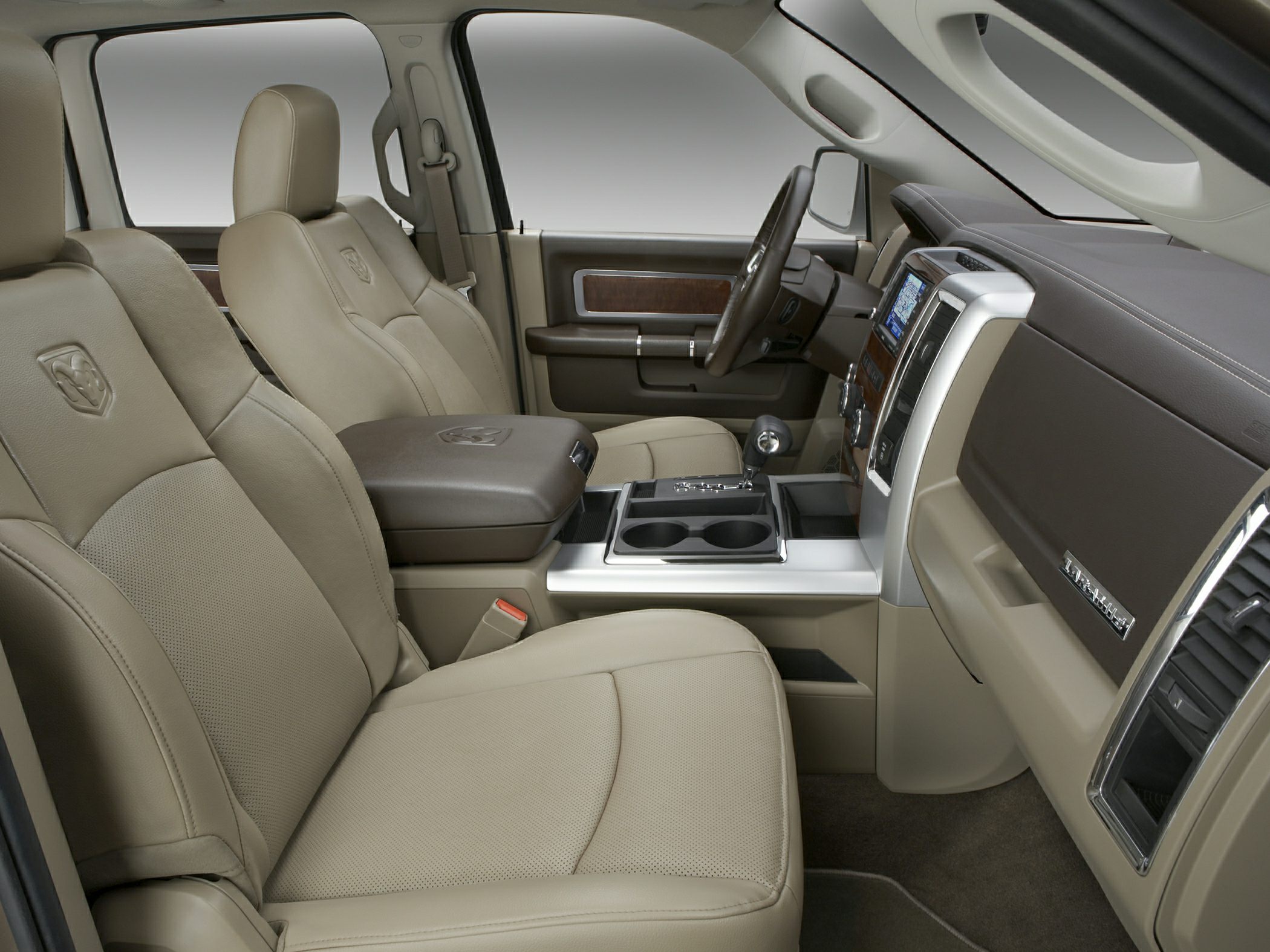 Beige leather seats and modern dashboard interior of a truck cabin