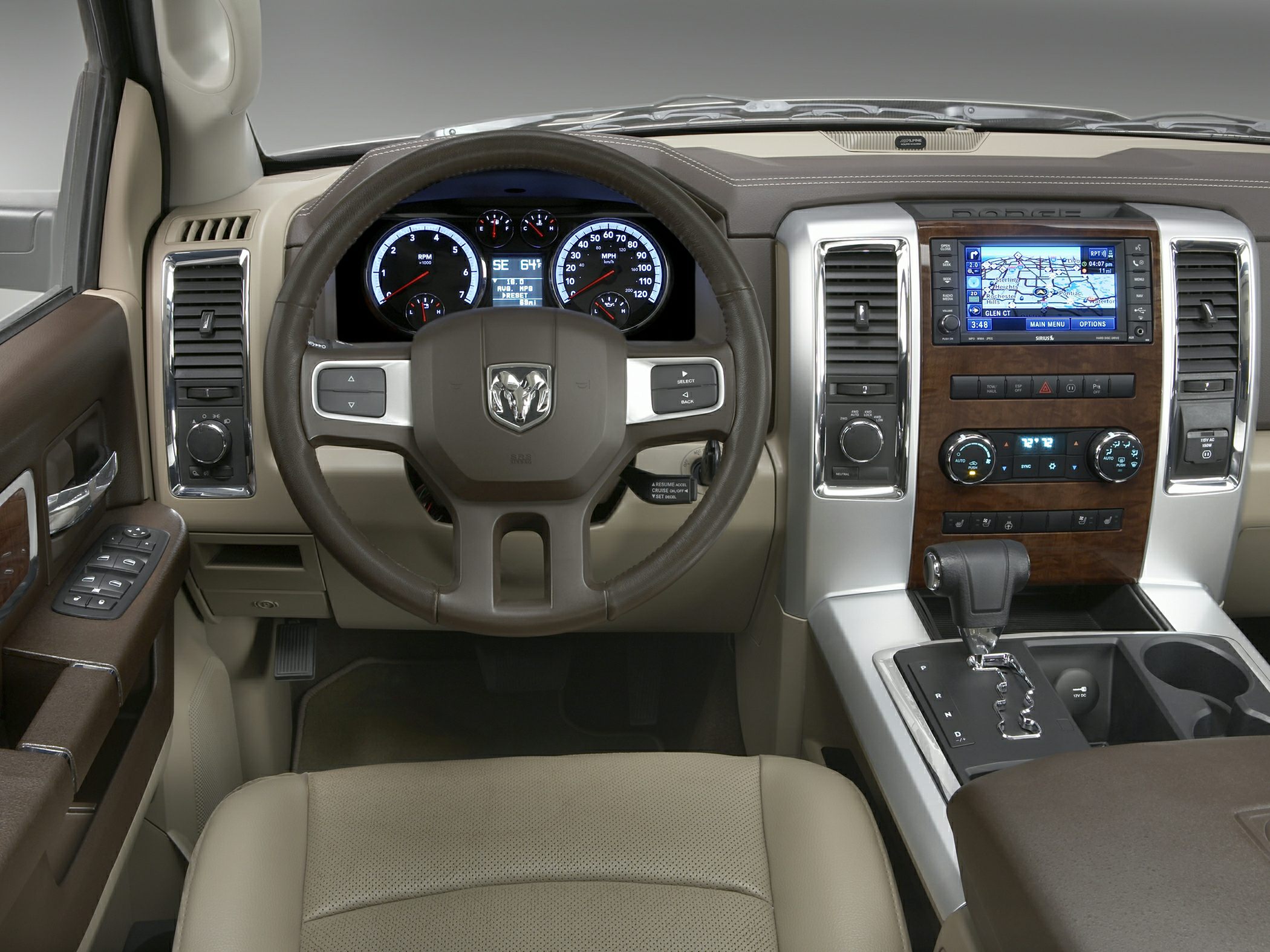Interior dashboard with steering wheel and center console featuring navigation and gauges