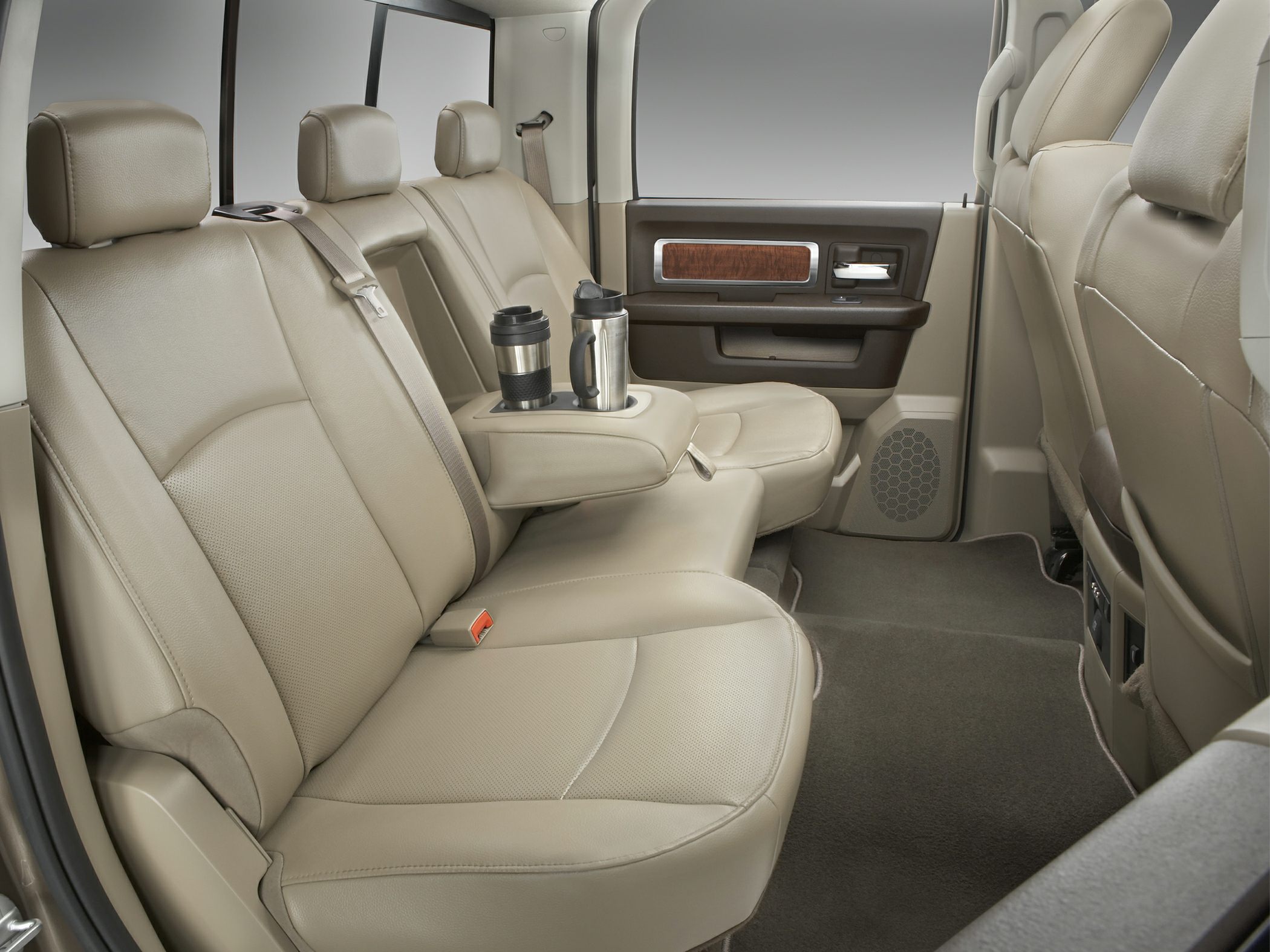 Tan leather rear seats with center armrest and cup holders