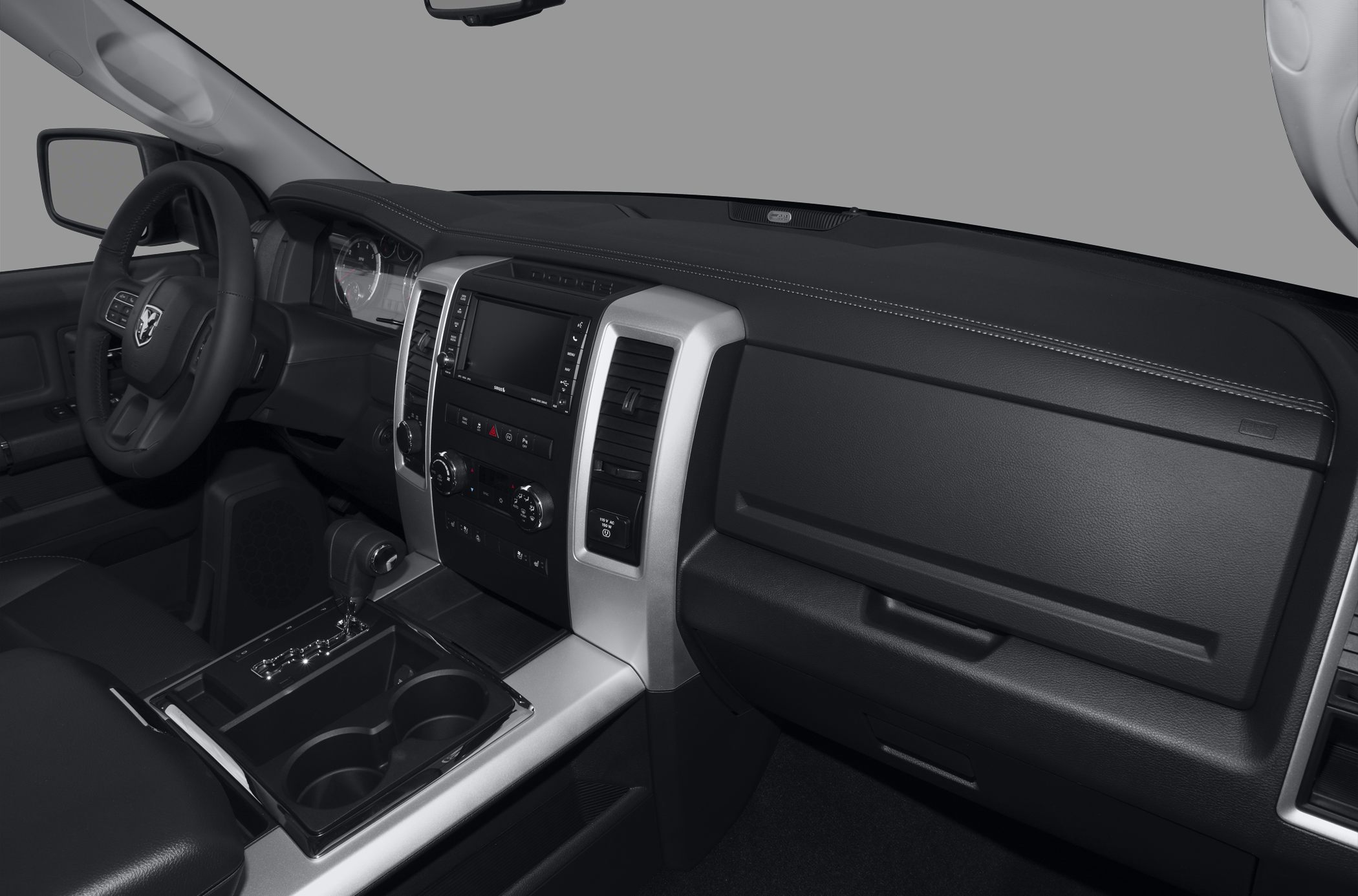 Dashboard and center console with gear shift and steering wheel