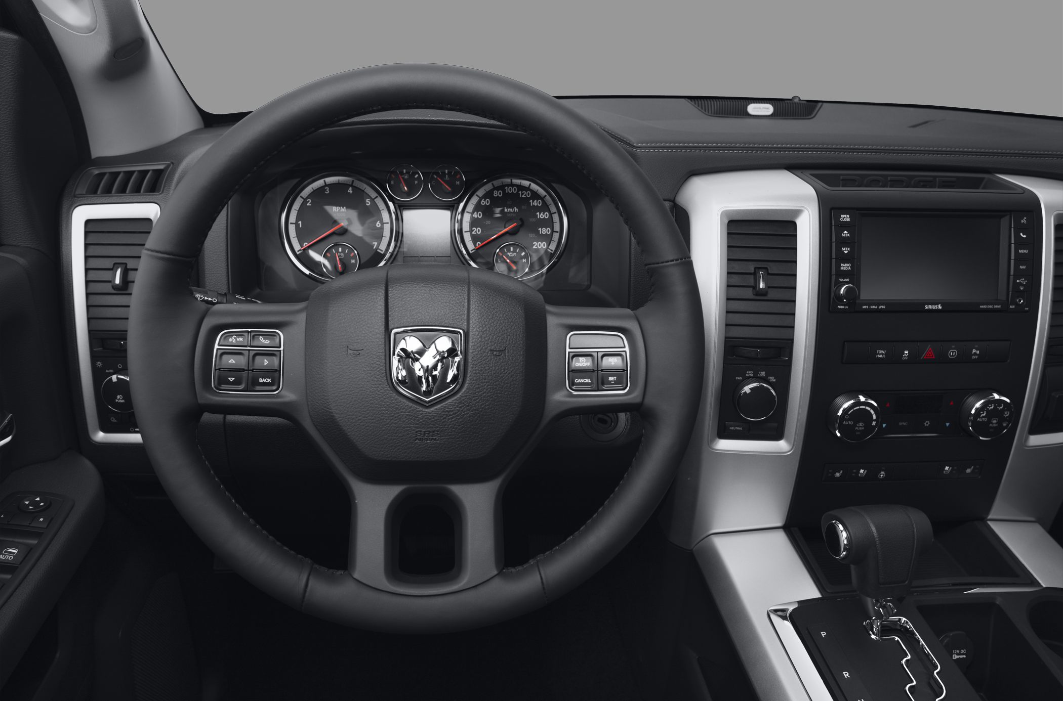 Truck steering wheel, instrument cluster, and center console with gear shift