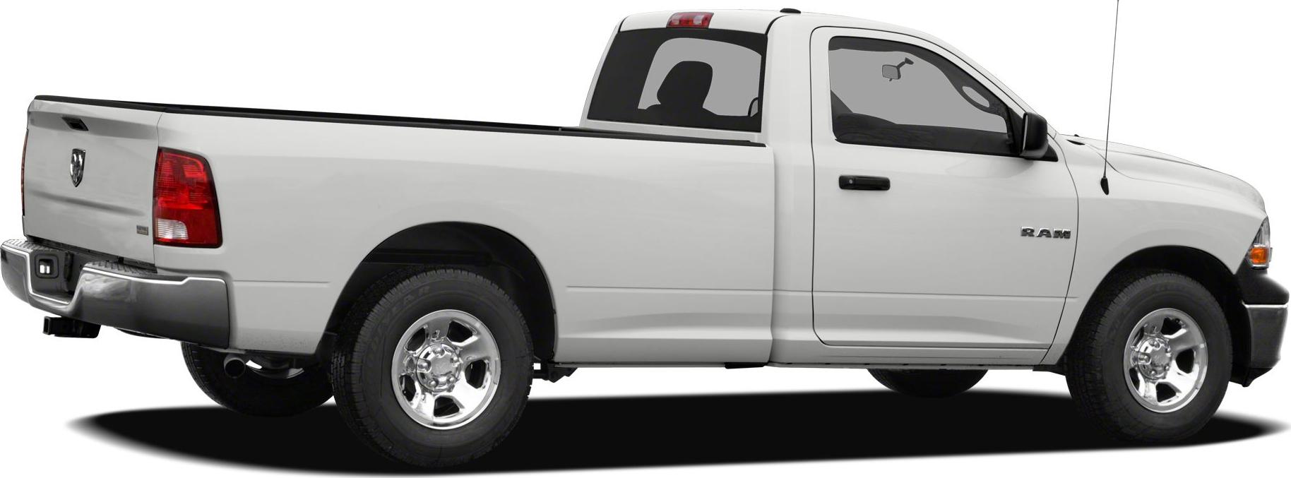 Side profile of a white single cab pickup with long bed and chrome wheels