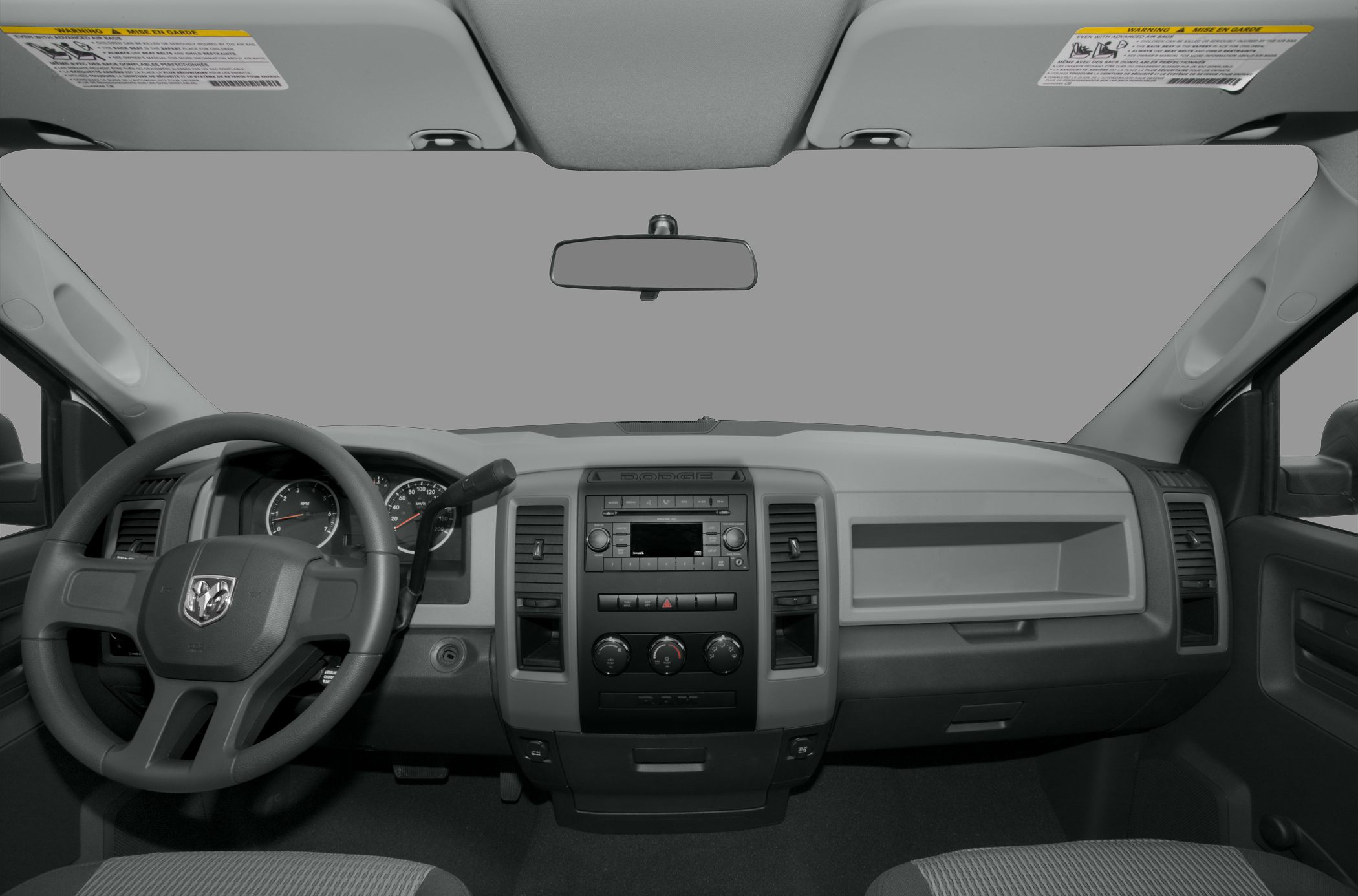 Dashboard and steering wheel with RAM emblem in truck interior