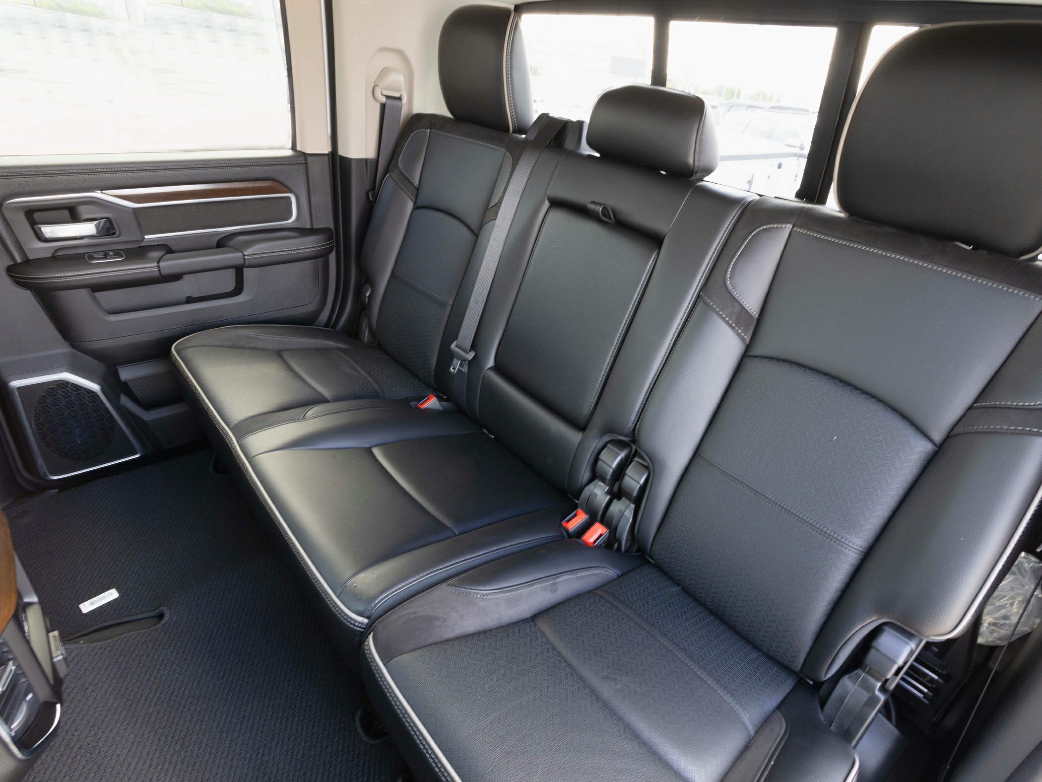 Luxury black leather rear seats with stitching and spacious design