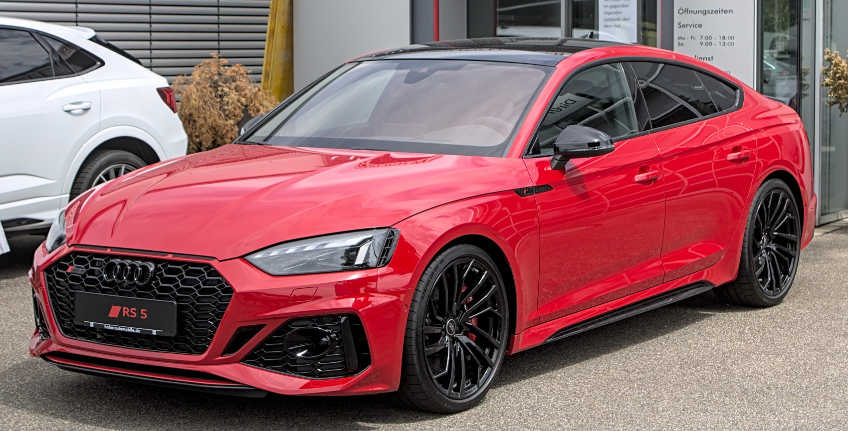 Red 2020 sportback with honeycomb grille and black wheels