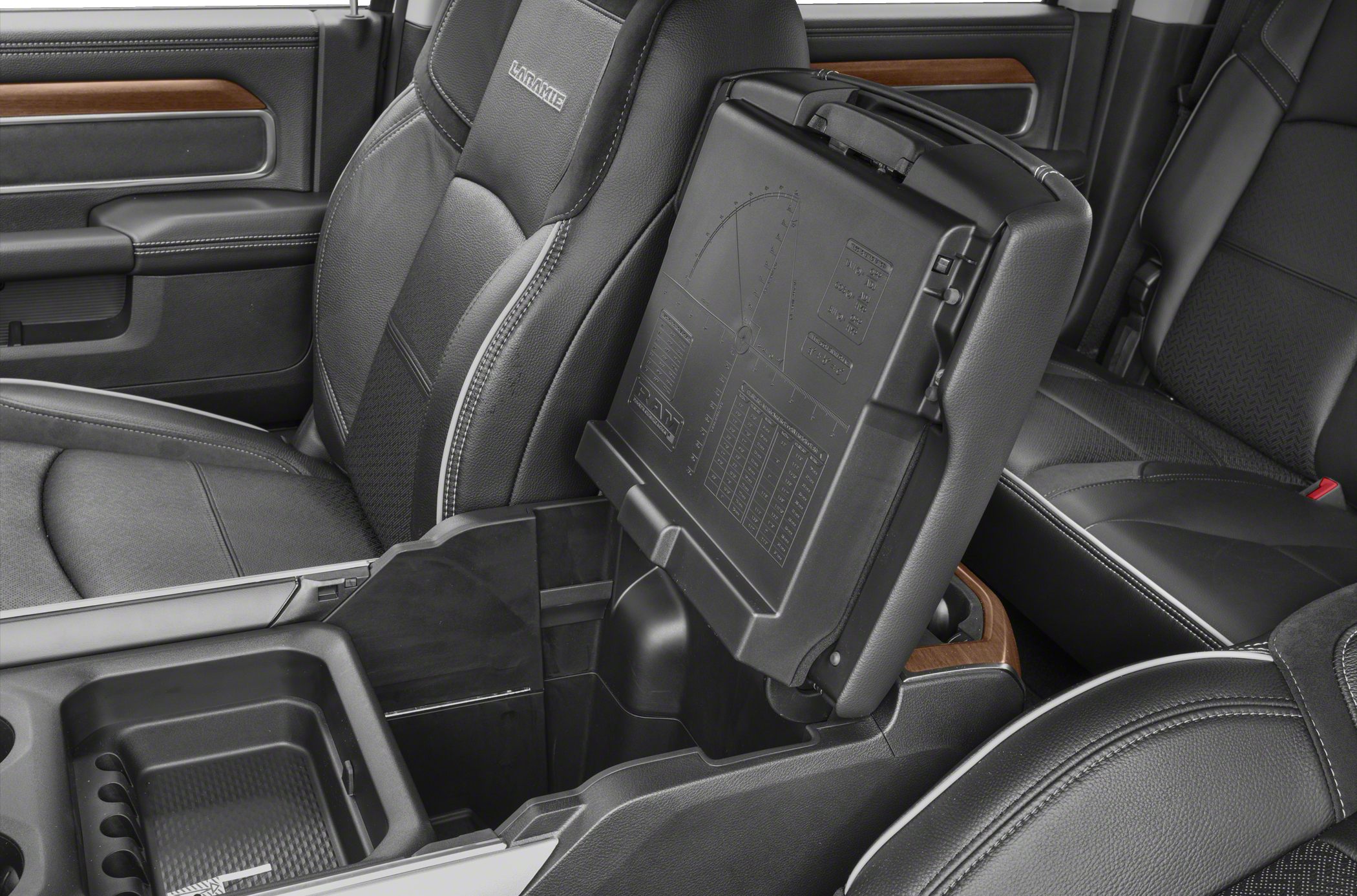 Leather seats with Laramie branding and a multi-use center console with storage compartment.