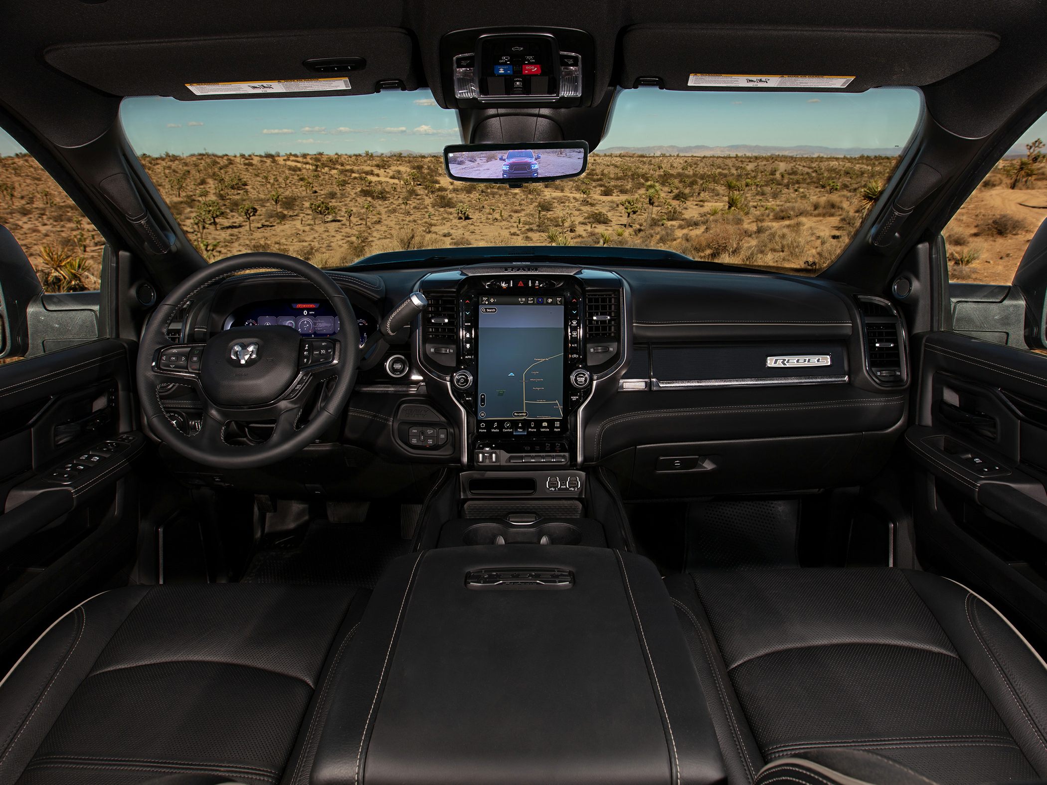 Spacious truck interior with digital dashboard and large touchscreen infotainment.