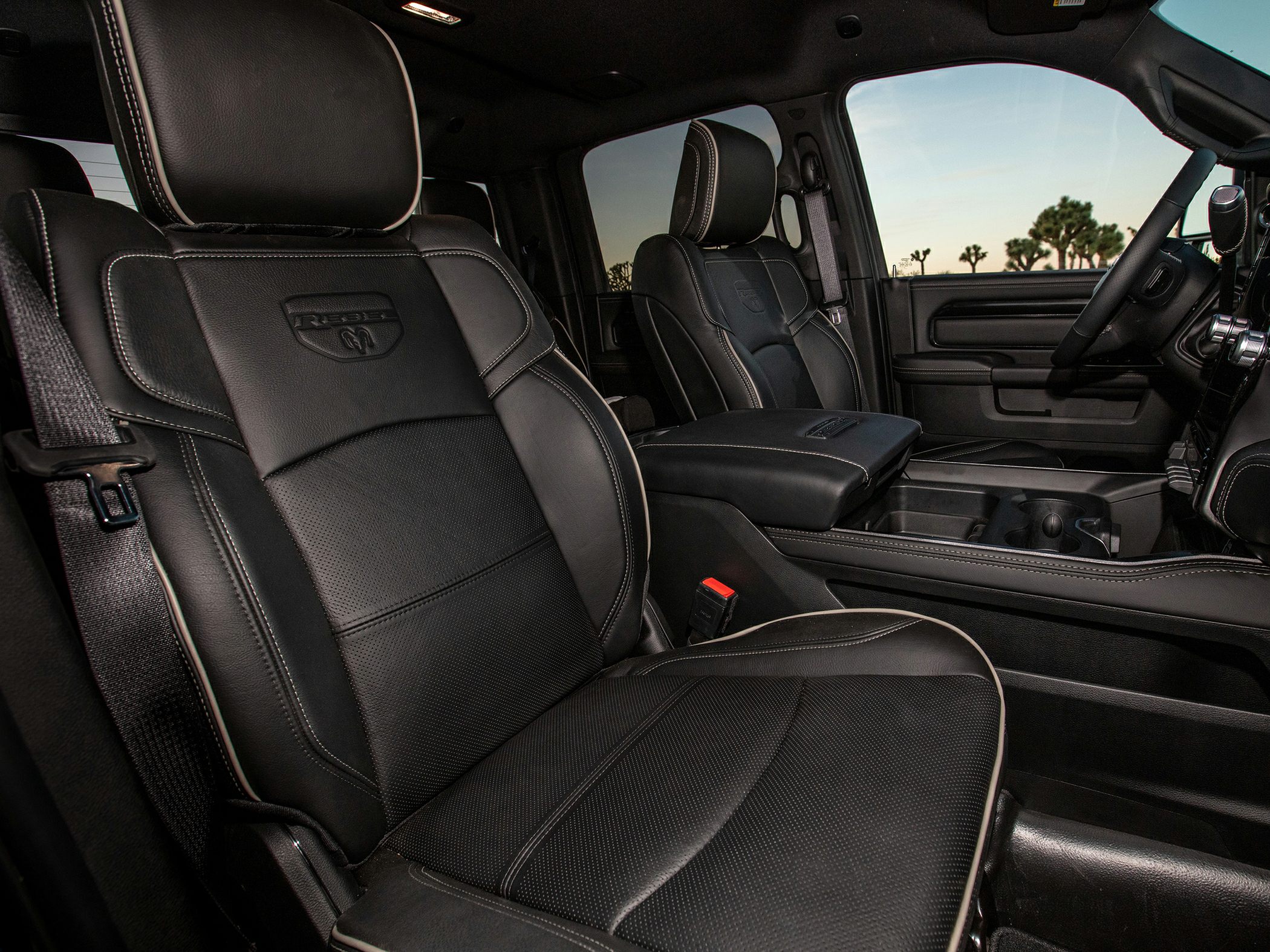 Black leather front seats with embossed logo and spacious cabin