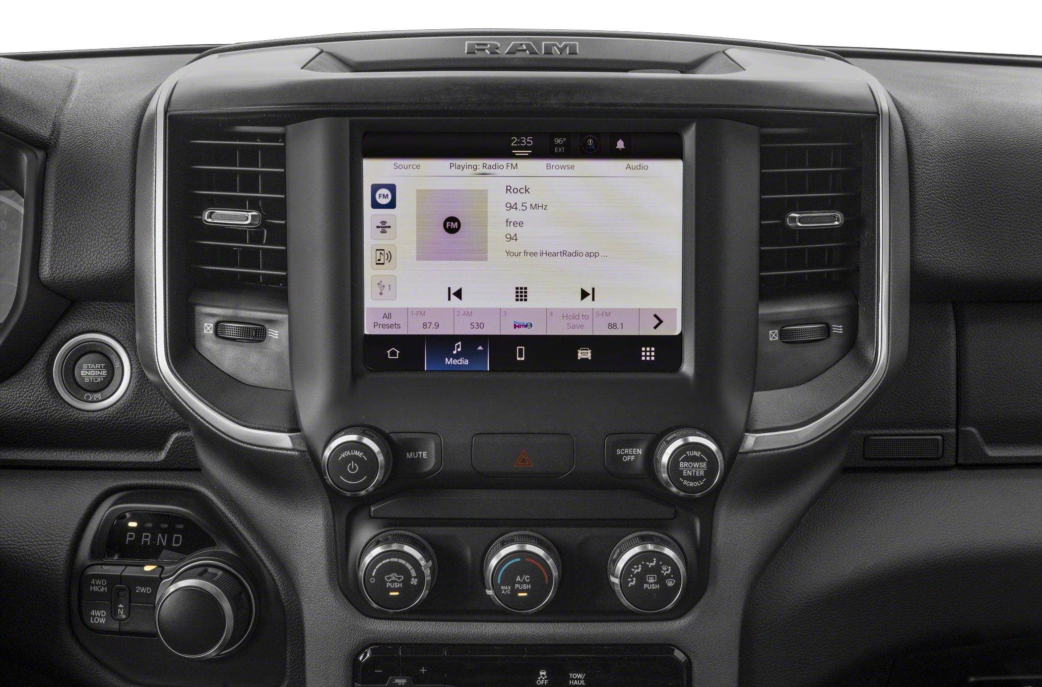 Infotainment touchscreen and dashboard controls with gear selector knob and start engine button