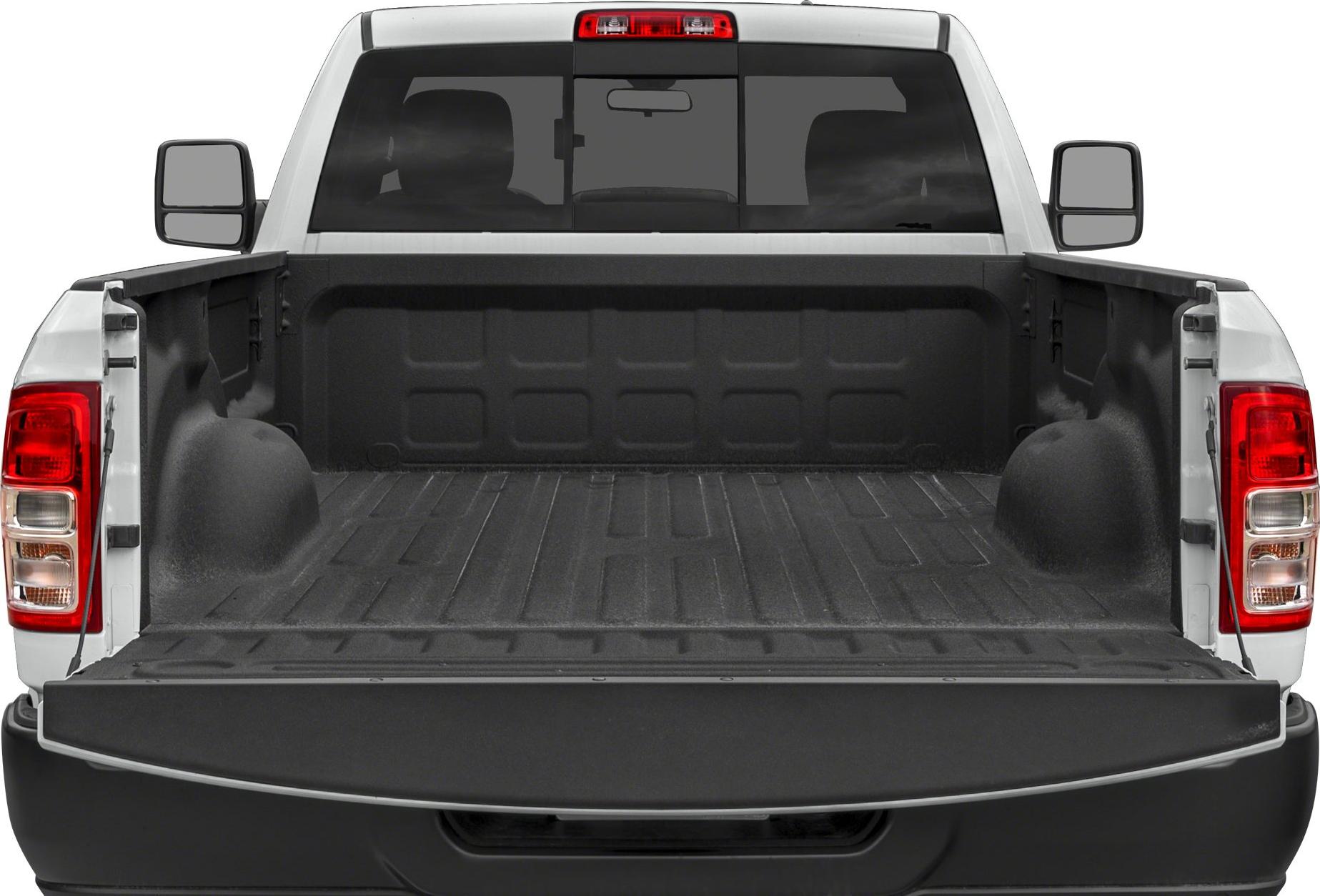 Open truck bed with black liner and tailgate in rear view