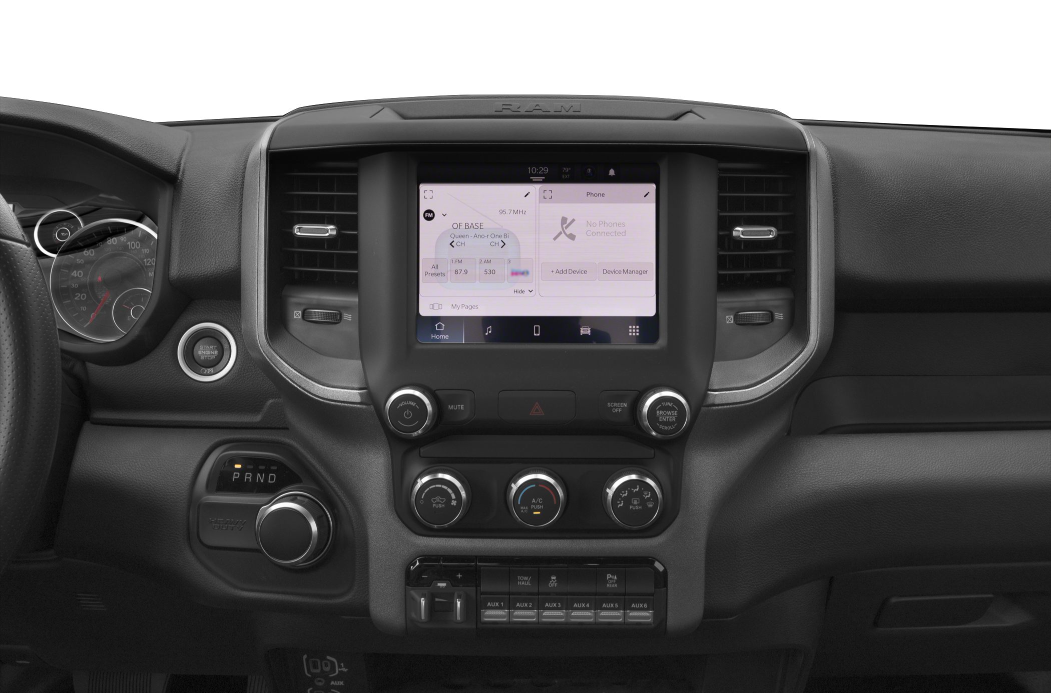 Infotainment screen, rotary gear shift, climate control knobs, auxiliary switches.