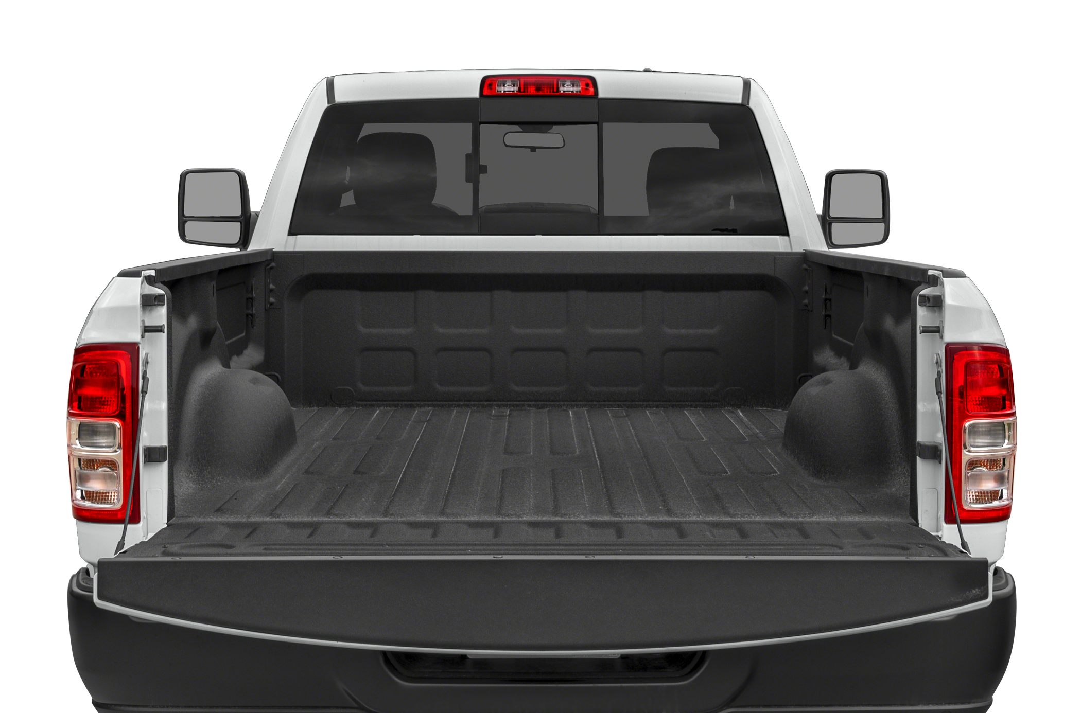 Open pickup truck bed with tailgate down and rear window with brake light