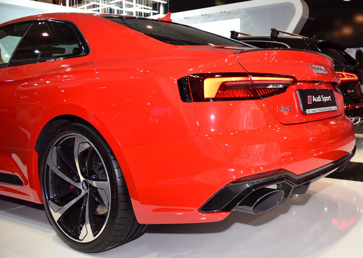 Rear view with sleek taillights and black alloy wheels