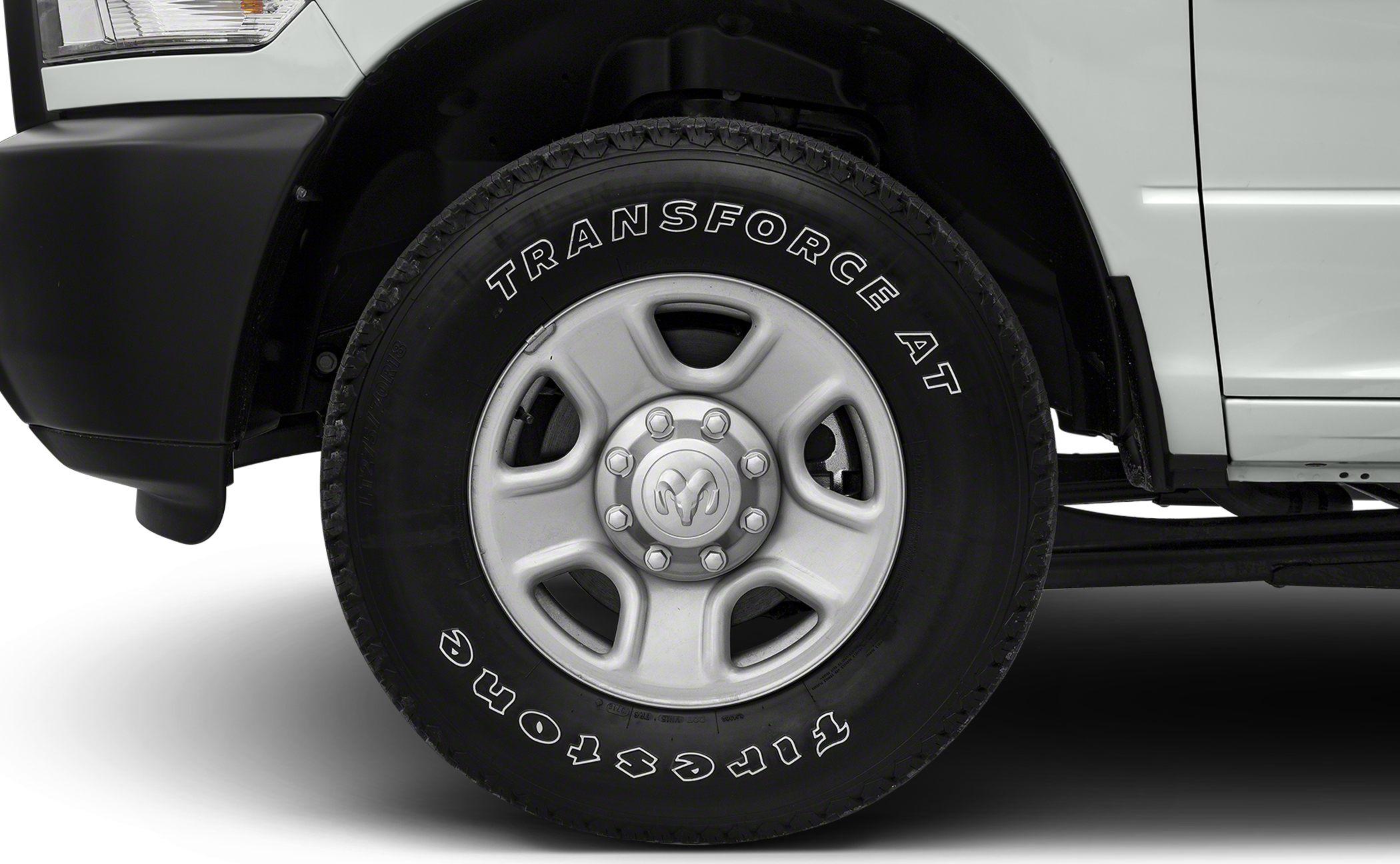 Close-up of a truck's wheel with Transforce AT tire and multi-lug rim