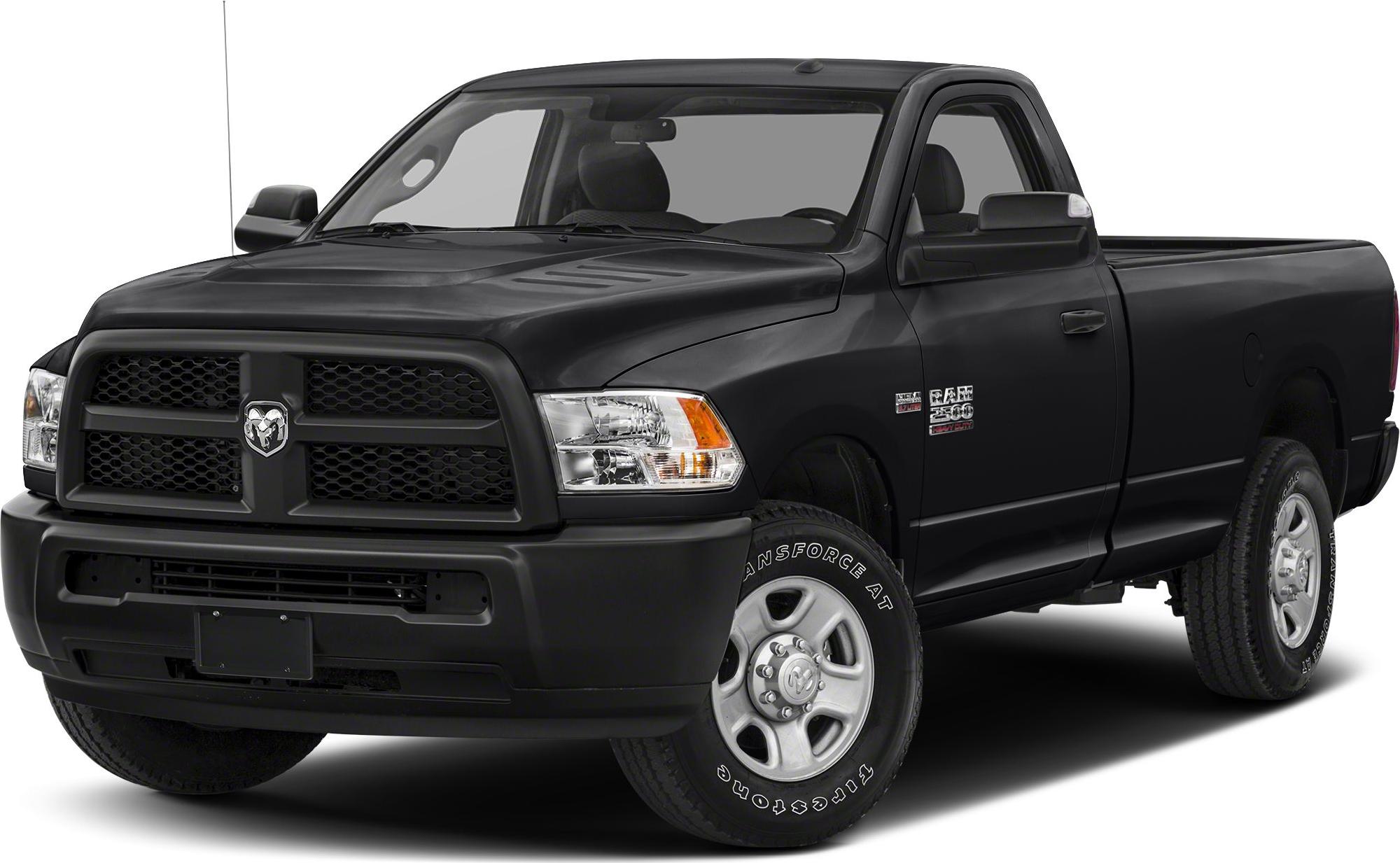 Front-side view of black pickup with prominent grille and headlight.
