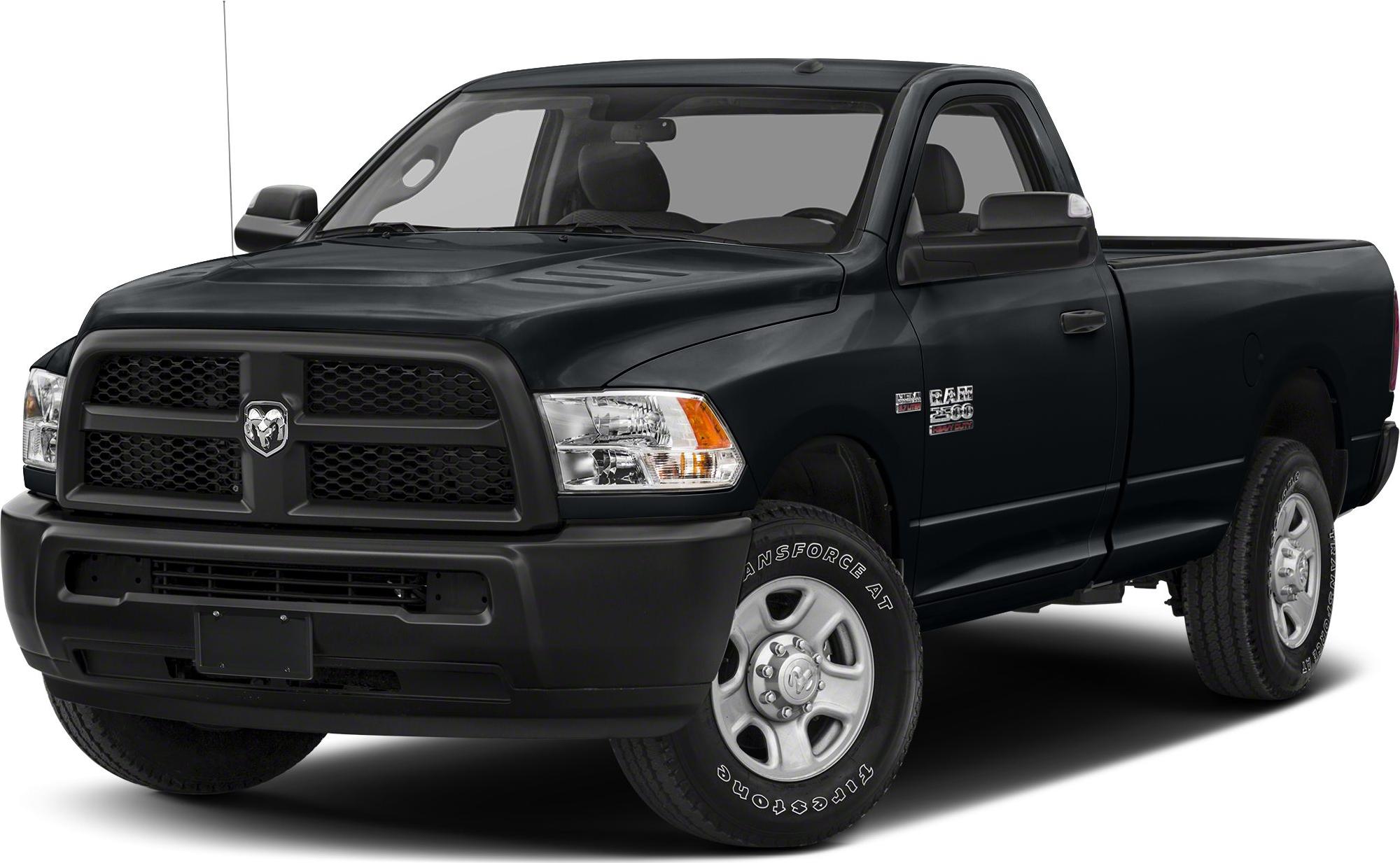 Front angled view of pickup's grille, headlights, and wheels