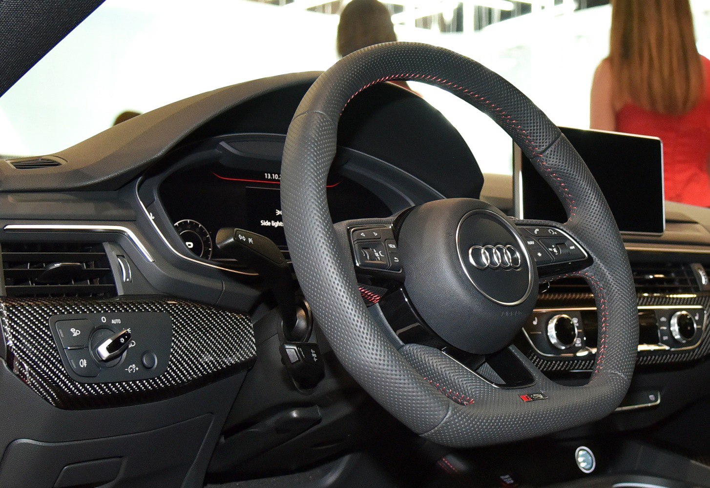 Steering wheel and digital dashboard with carbon fiber trim