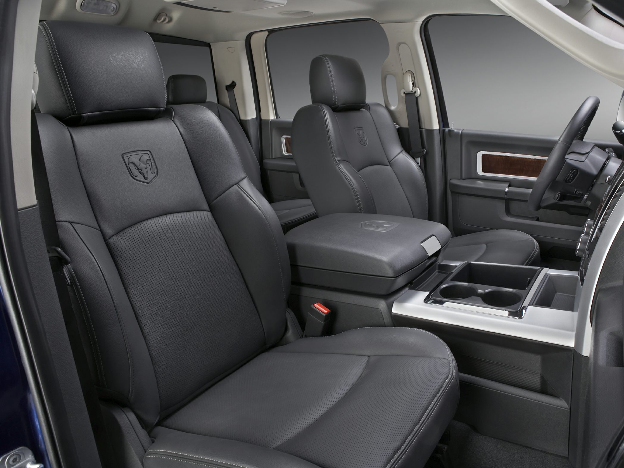 Black premium leather seats with embossed logos and spacious cabin layout