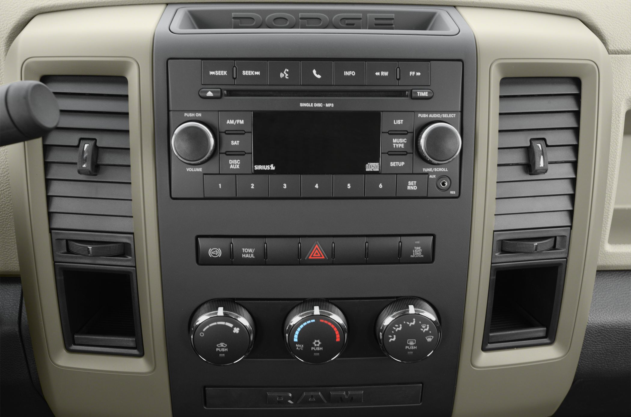 Dashboard radio controls, climate knobs, and air vents