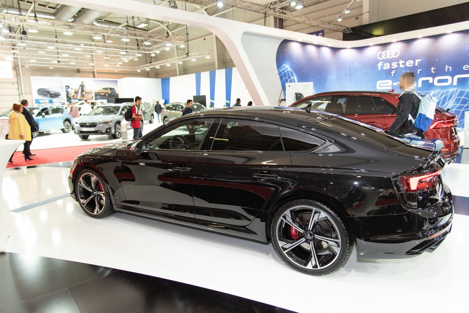 Black sleek coupe with sporty alloy wheels and tinted windows