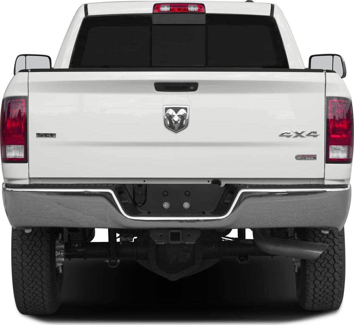 Rear view of a pickup with 4x4 and diesel badges, chrome bumper, and dual rear tires.