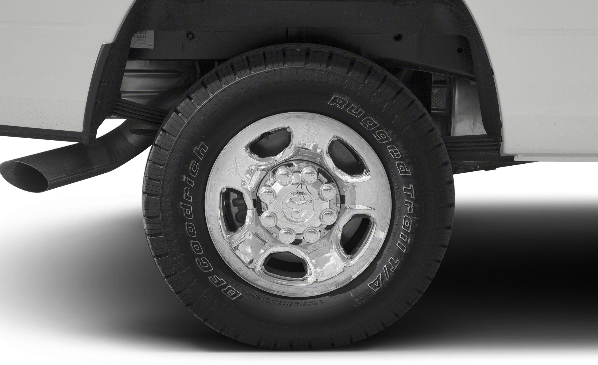 Rugged BFGoodrich tire and polished steel wheel with exhaust and suspension details