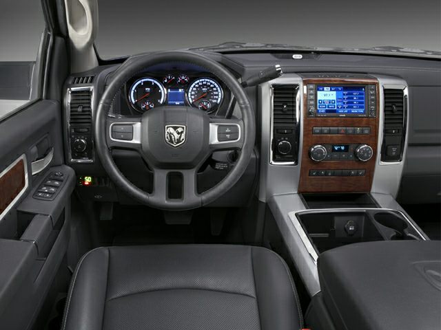 Interior dashboard and steering wheel with wood panel accents