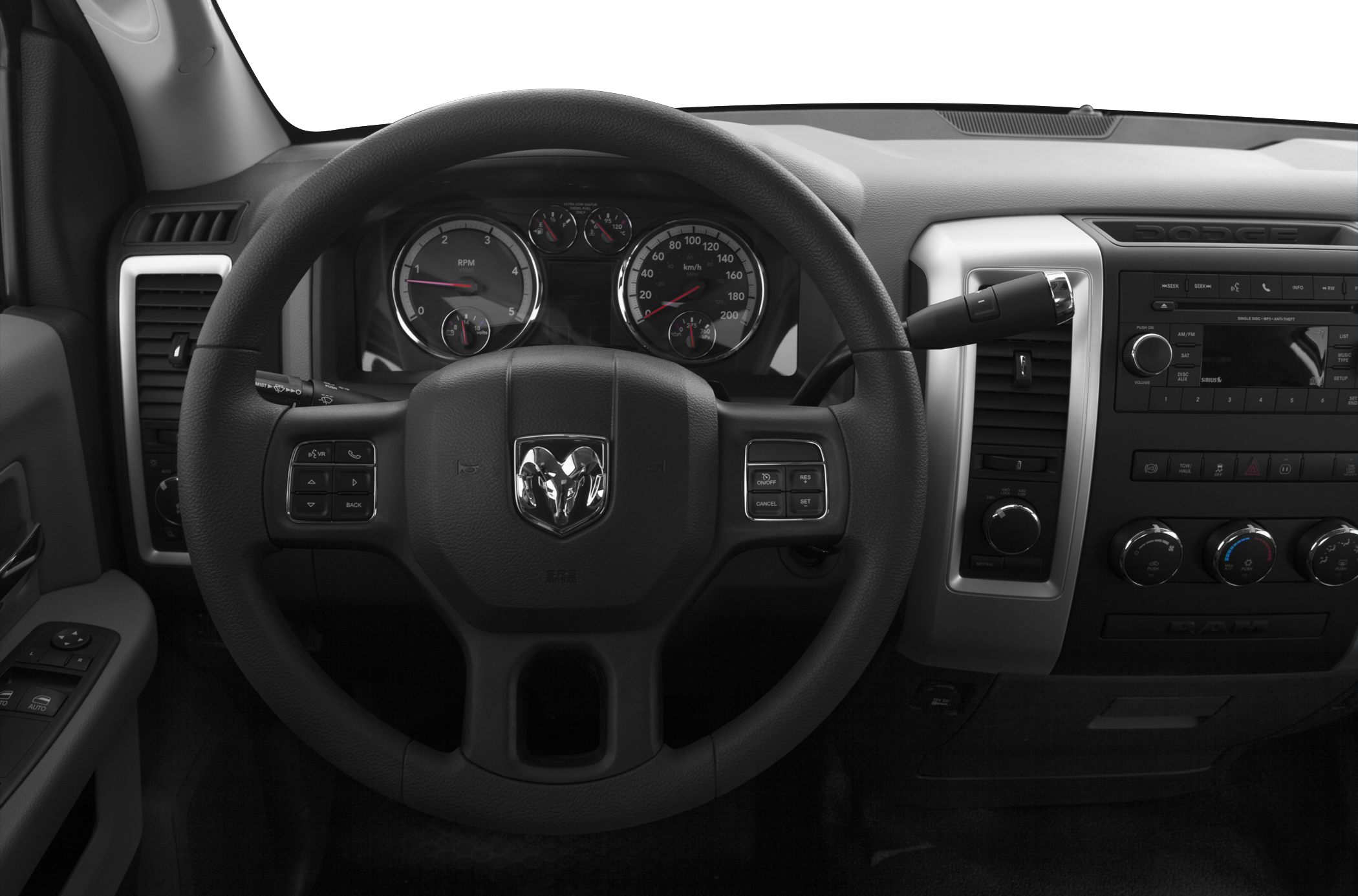 Steering wheel with controls and instrument cluster in truck dashboard