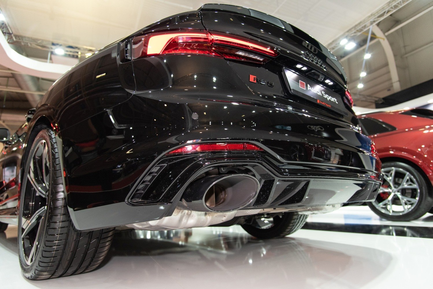 Close-up of rear taillights and large exhaust pipe detailing