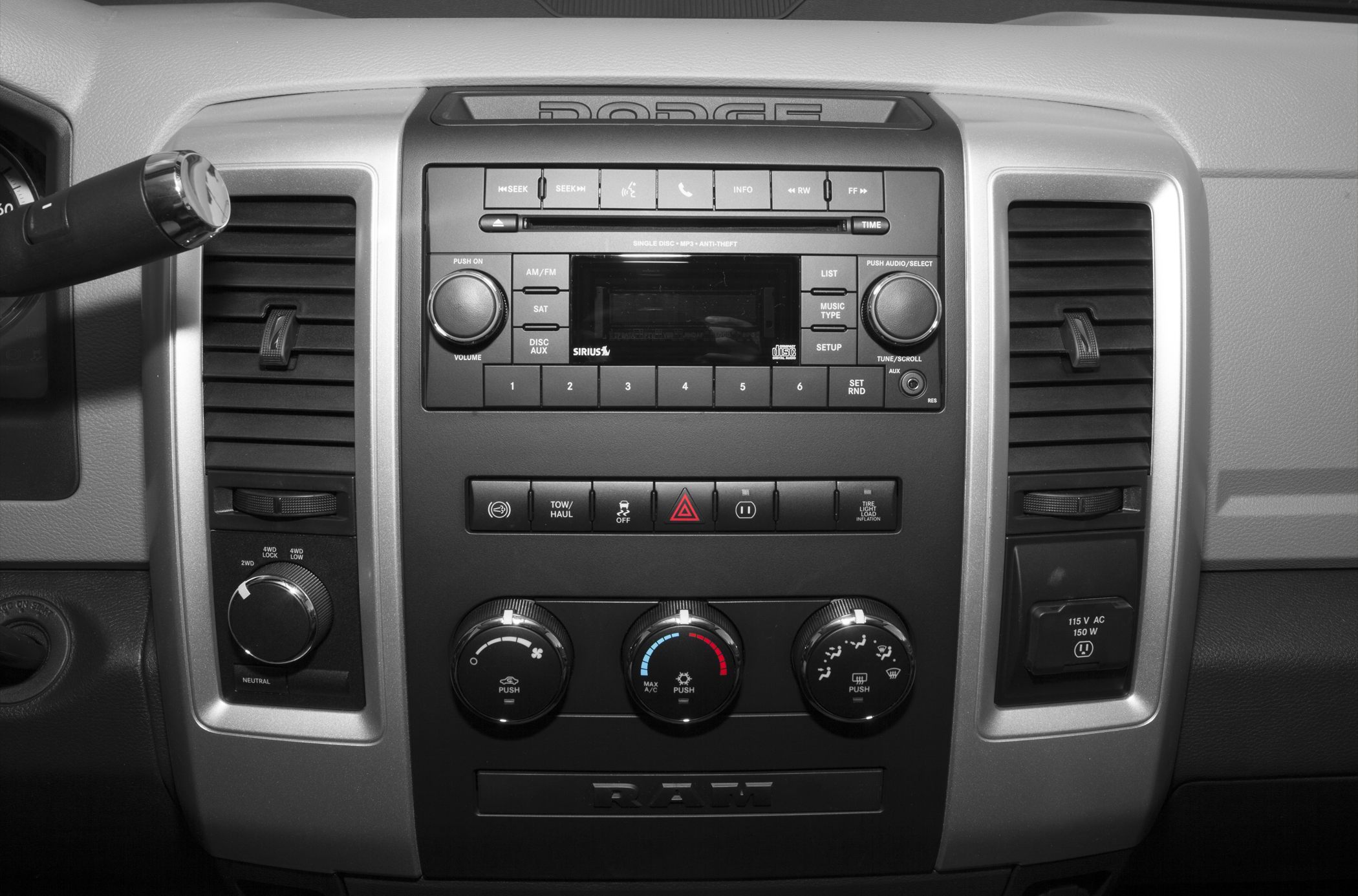Dashboard with 4WD selector, radio, climate control knobs, and towing switches