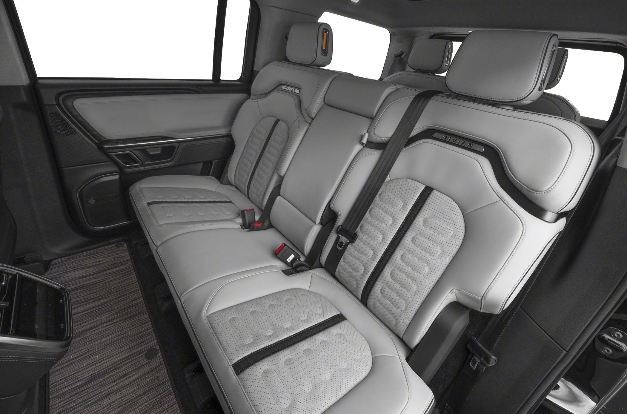 Luxurious rear leather seats with detailed stitching and spacious SUV cabin.