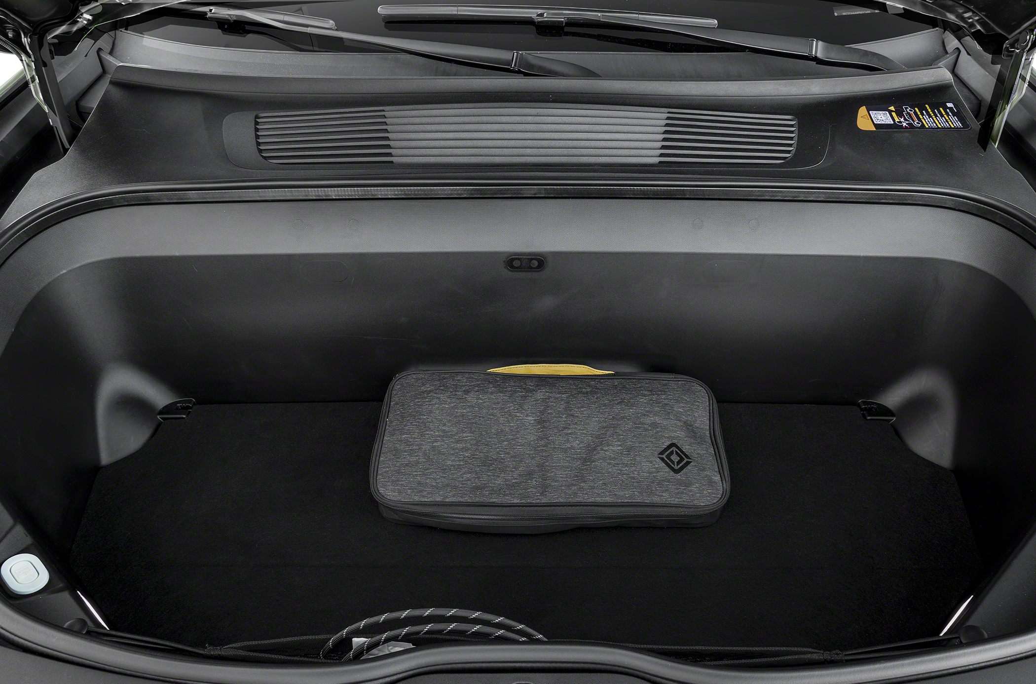Spacious front trunk (frunk) with storage bag and charging cable